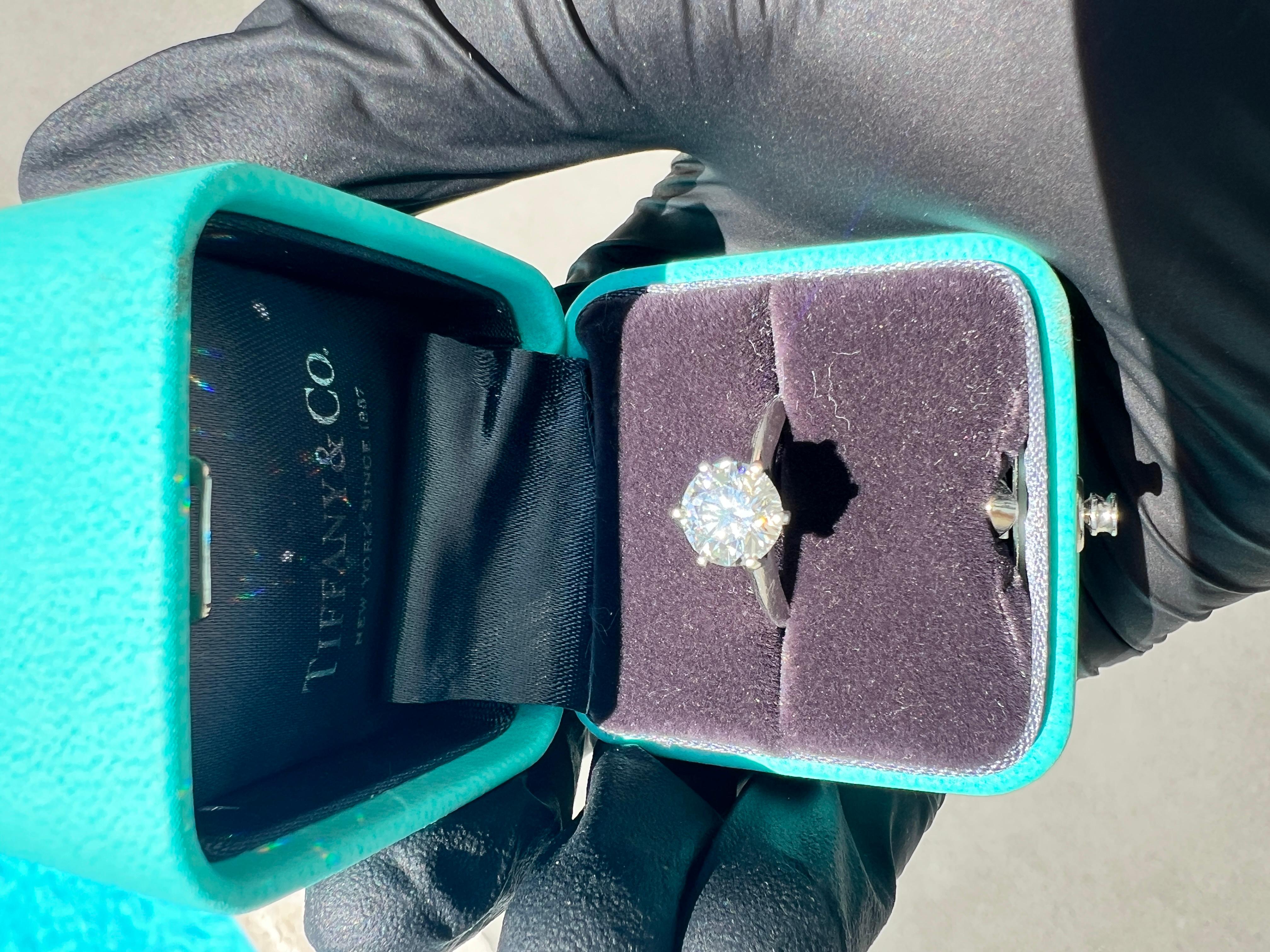 A timeless classic from the world’s most iconic jeweler, this Tiffany & Co. platinum solitaire engagement ring features a 1.78 carat round brilliant diamond, graded I color and VS2 clarity. Expertly cut to Tiffany’s exacting standards, the diamond
