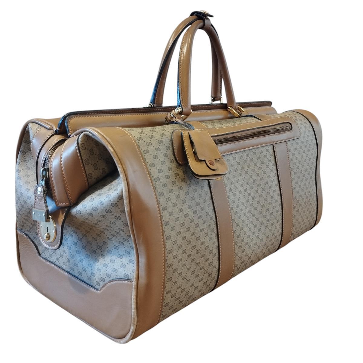 Extremely rare Gucci vintage travel suitcase/bag
40's/50's Period
Leather and textile
Beige color
GG Logo
Double handle
Zip closure
Two external zip pockets
Internal large pocket
Cm 56 x 27 x 27 (22 x 10,62 x 10,62 inches)
Good/fair overall