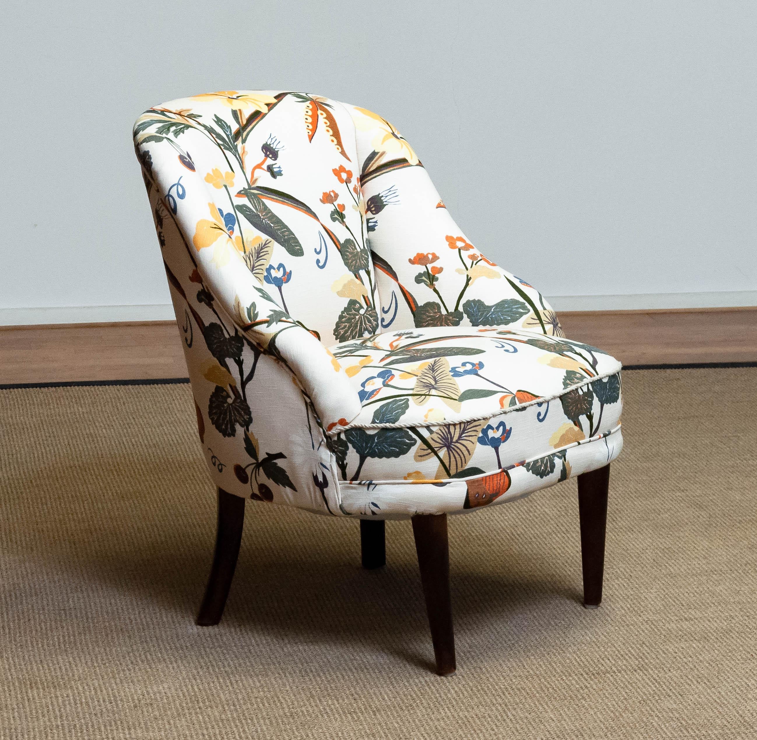 Beautiful Danish slipper chair from the 1940s new upholstered with floral printed linen similar to the famous and bright Josef Frank fabrics. Frame and legs are made of beech and both in good condition. Hand-tied springs and webbing are also in very