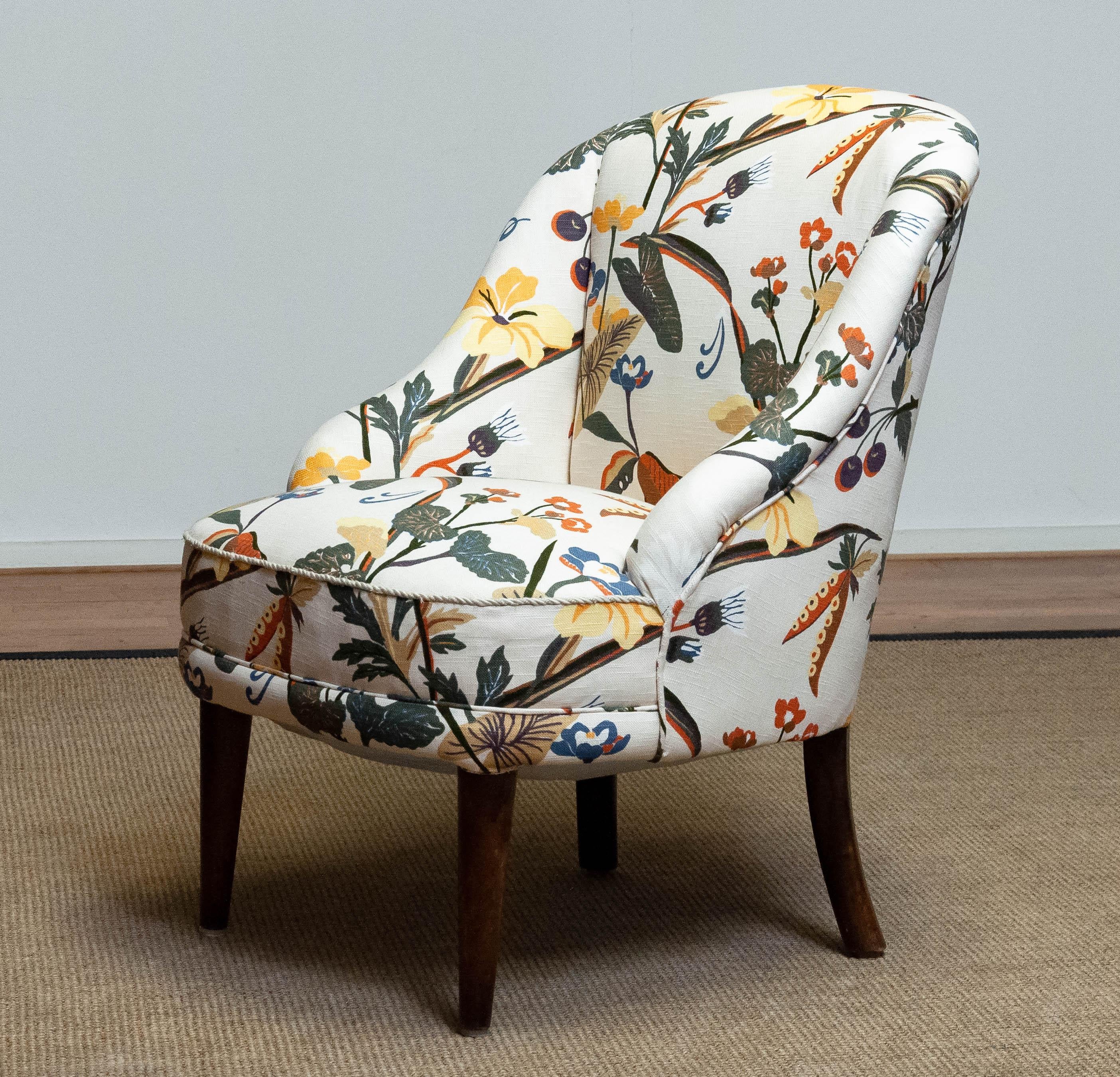 Beautiful Danish slipper chair from the 1940s new upholstered with floral printed linen similar to the famous and bright Josef Frank fabrics. Frame and legs are made of beech and both in good condition. Hand-tied springs and webbing are also in very