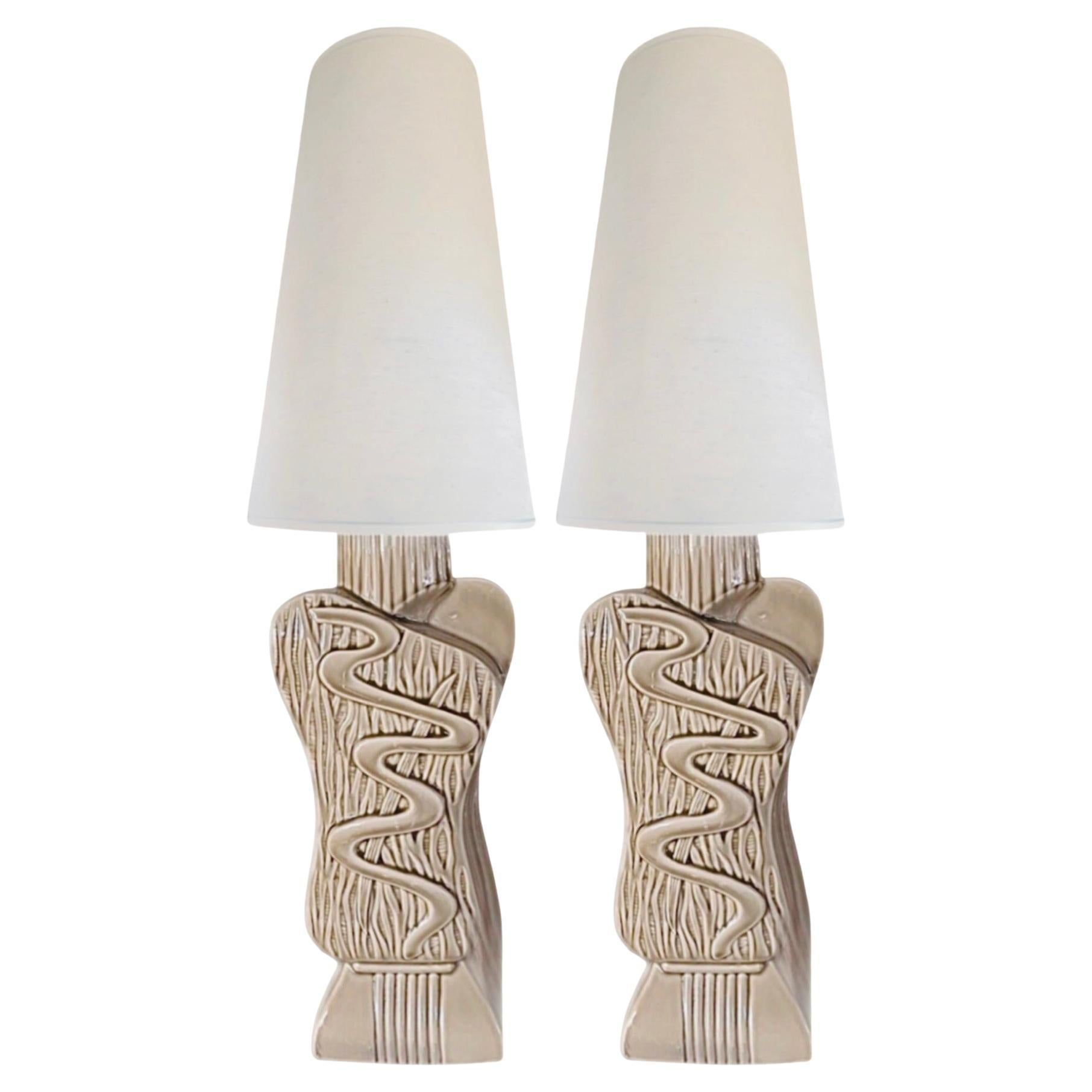 Exquisite, organic, freeform pair of late 1940s ceramic lamps. 

The pair blend traditionalism and modernism, characterized by sleek lines, organic forms, and a focus on functionality.

The 1940s saw a transition from traditional styles to more