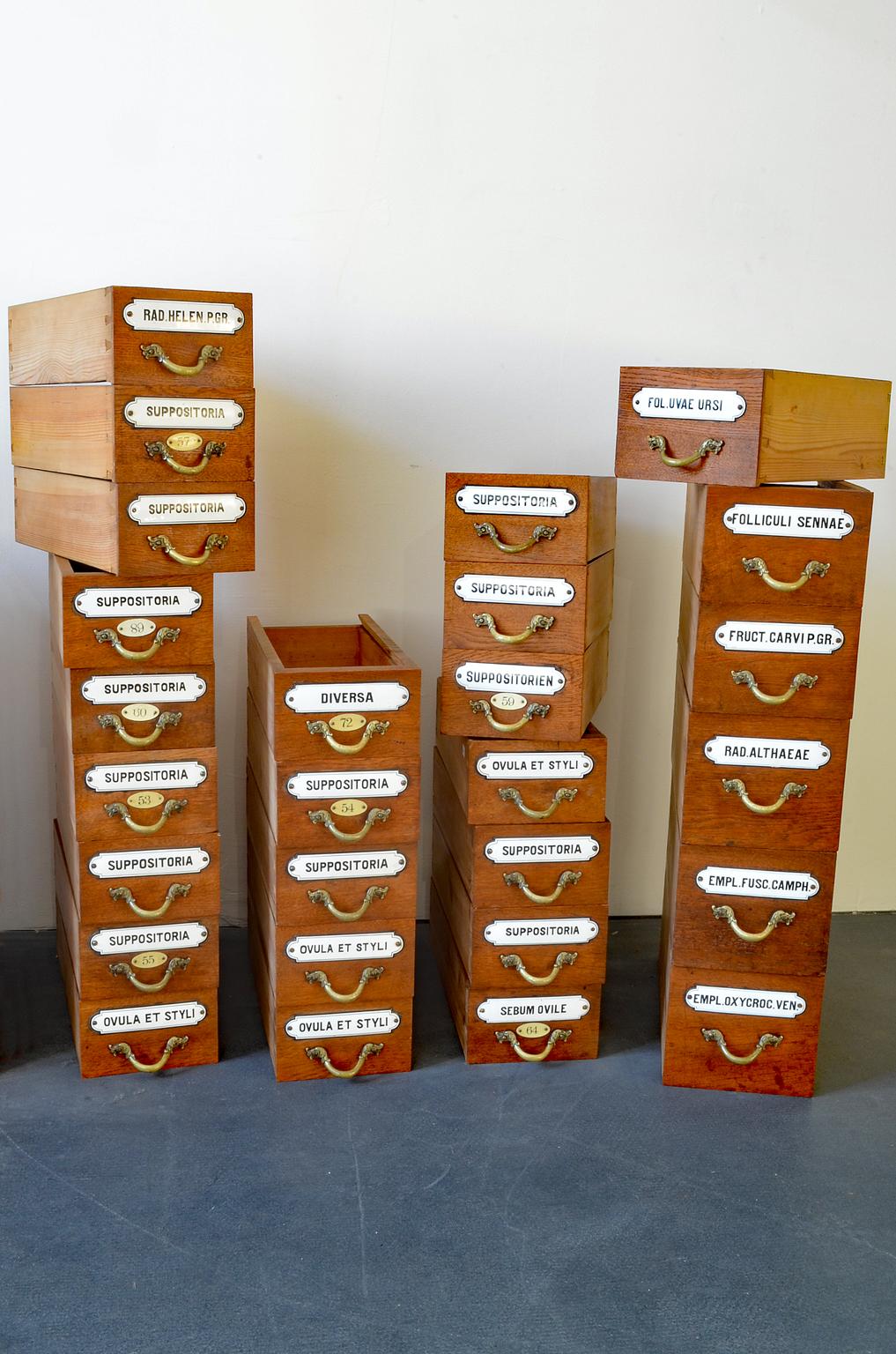 41 antique Apothecary drawers with enameled label and figurative bronze handle late 19th century from Germany.
Measure:
35 pieces: DxWxH in cm 38 x 15 x 9 
6 pieces: DxWxH in cm 38 x 17 x 11-15.