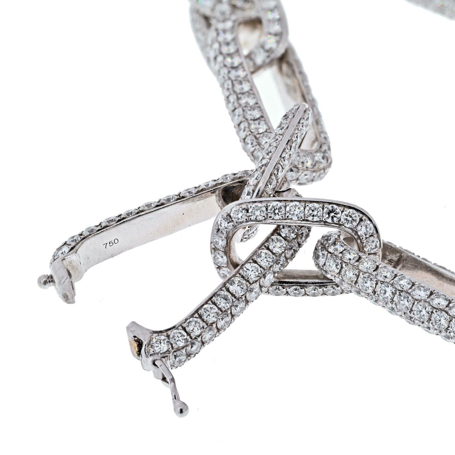 This fine link chain necklace features 41.37cttw of pave set round cut diamonds and is finished in 18 karat white gold. The necklace measures 18 inches in length and the pave links go all the way around. This could be worn every day and would be a