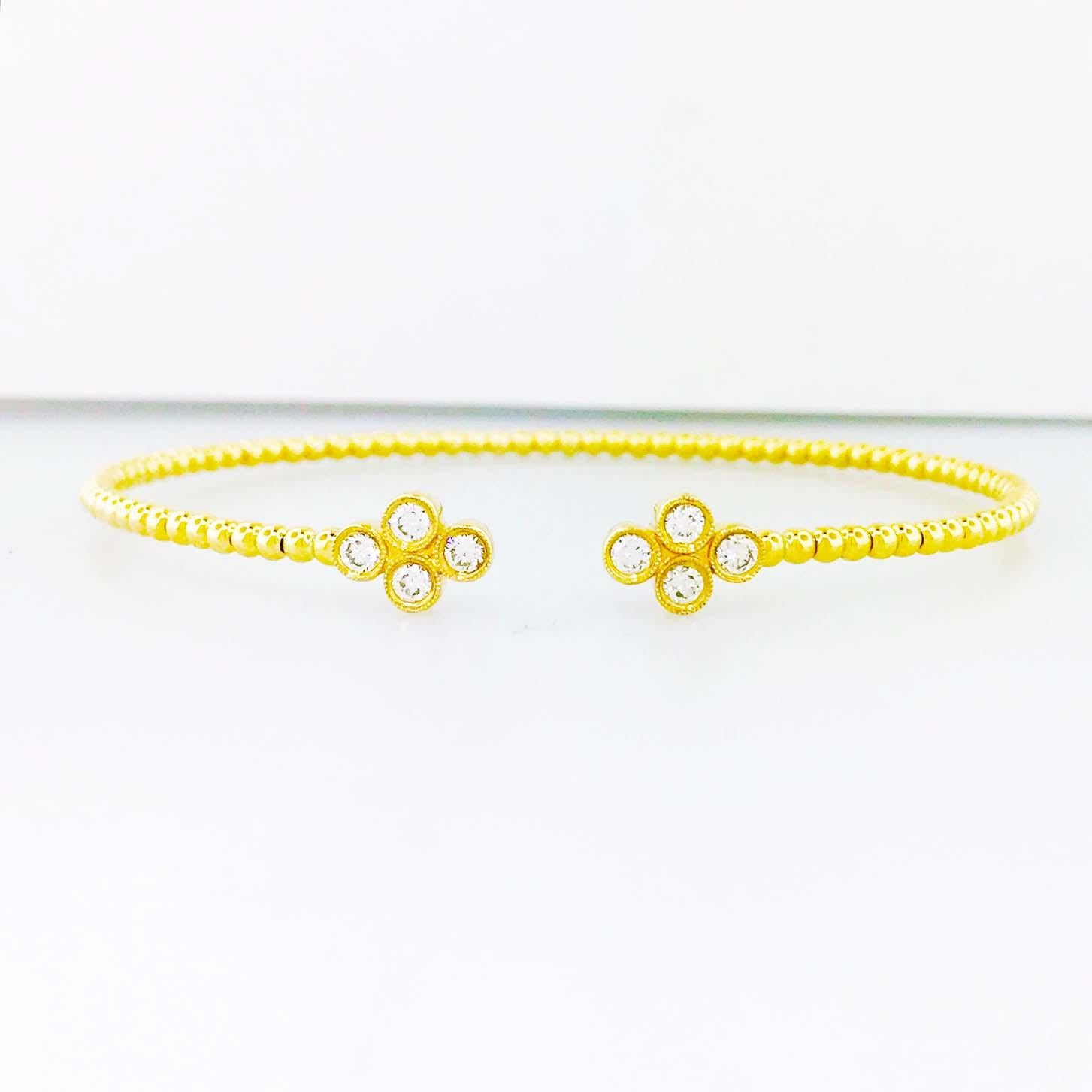 FUN! COLLECTIBLE! DESIGNER! DIAMOND FASHION BANGLE BRACELET! 

This fun designer diamond bangle bracelet is so adorable and looks great on everyone! With four round diamonds set in a modern, clover shaped, bezel setting on each side this bracelet