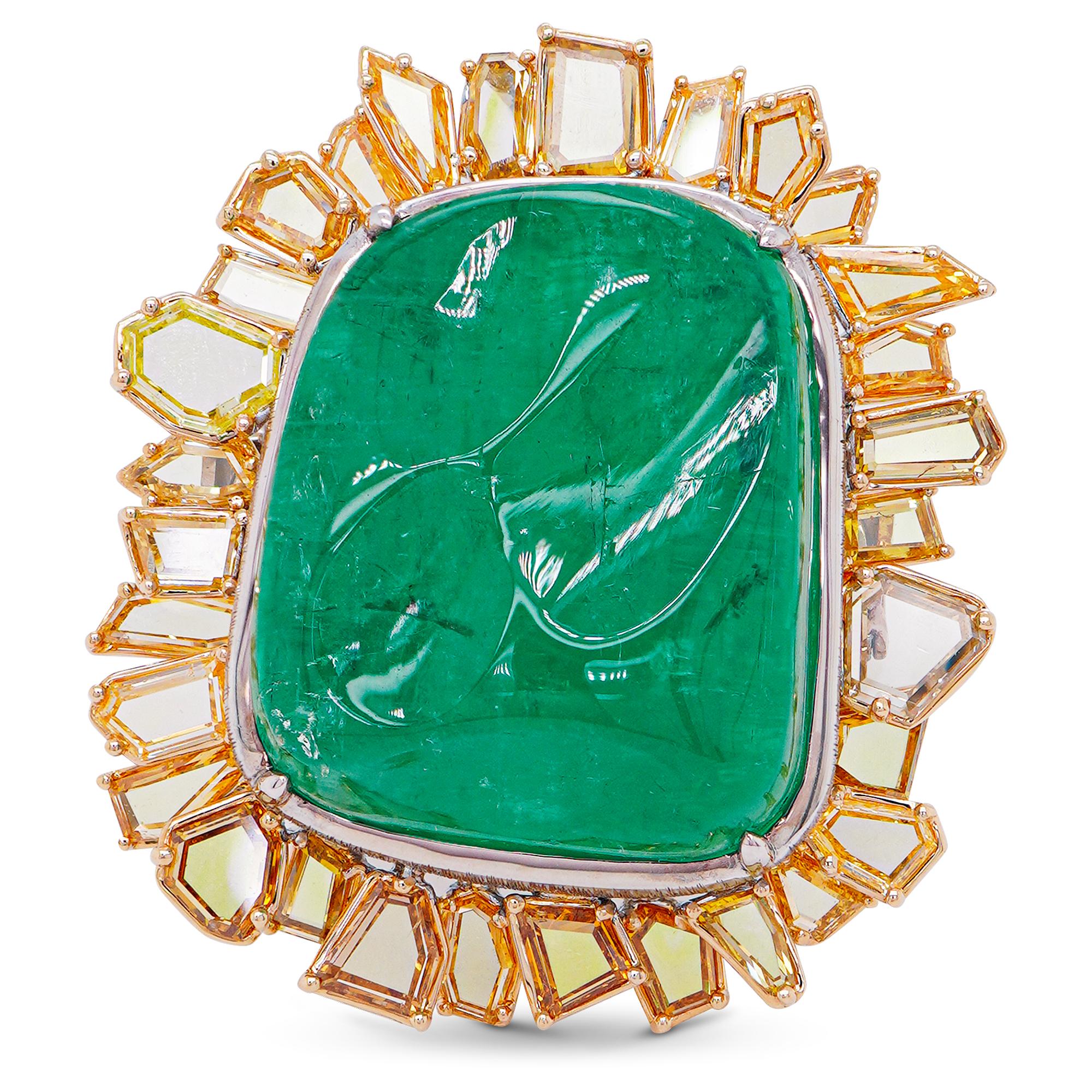 This exquisite piece is a testament to masterful craftsmanship and luxury. At its heart lies a breathtaking 41-carat emerald, its lush green hue captivating and rich. Complementing this centerpiece is a 4.37-carat fancy color diamond, adding a touch