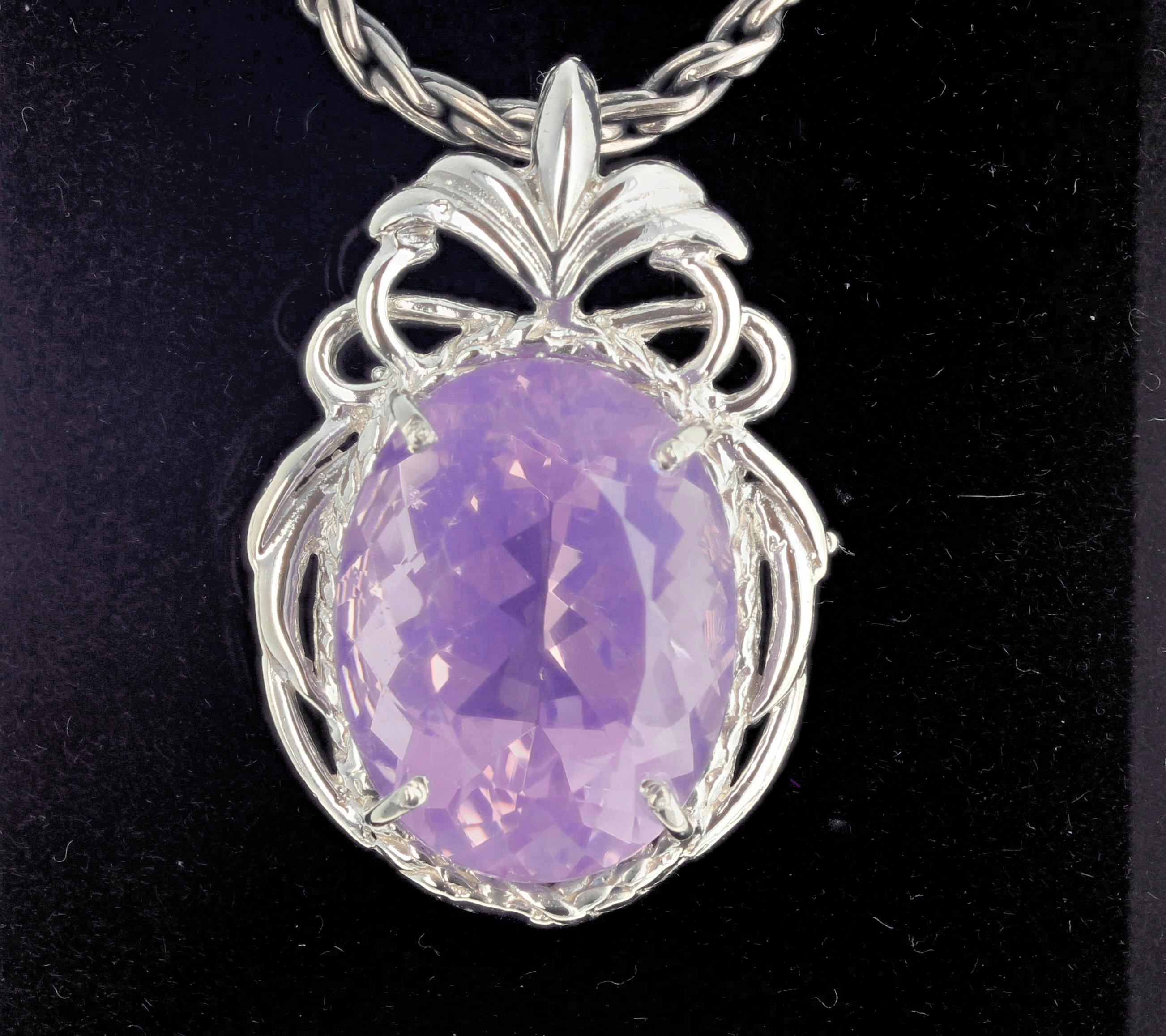 Extraordinary unique 41 carat Lavender Amethyst (22 mm x 17 mm) changes its color from pinky to purpley every time it moves.  There are no eye visible inclusions, it is approximately 1.5 inches long,  and it glitters from every direction but doesn't