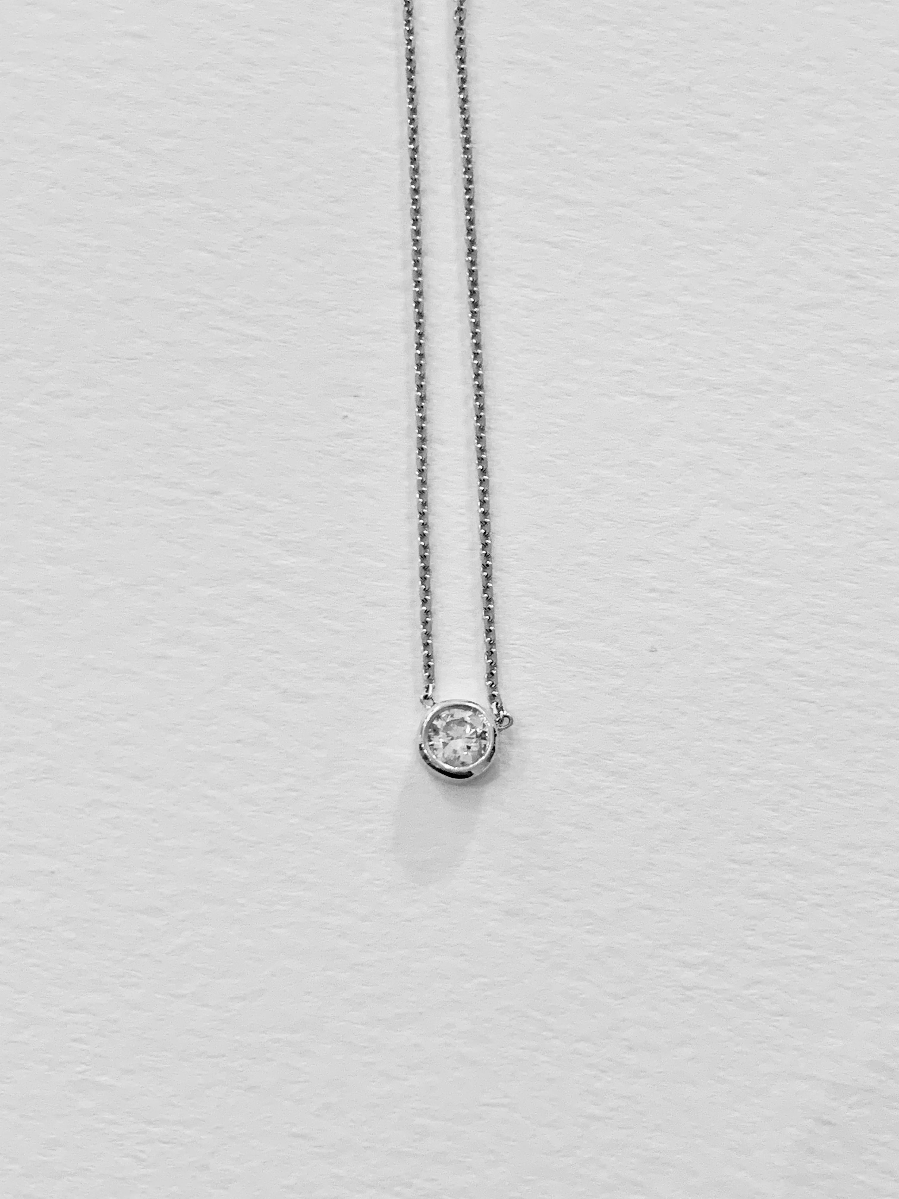 This is a very elegant and delicate bezel design necklace,  16 inches in length with the intention for it to be worn close to the neck to give a shimmer of a stone and to be constantly on show.  The .41 ct Round Brilliant Cut Diamond has a colour of