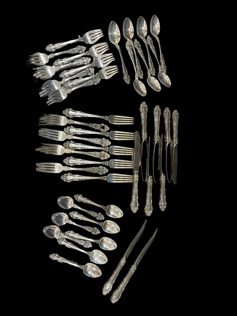 41 Pcs Reed & Barton Mirrorstele Sterling Flatware
Includes
9 Dinner Forks
8 Salad Forks
7 Soup Spoons
8 Table Spoons
7 Butter Knives
2 Steak Knives