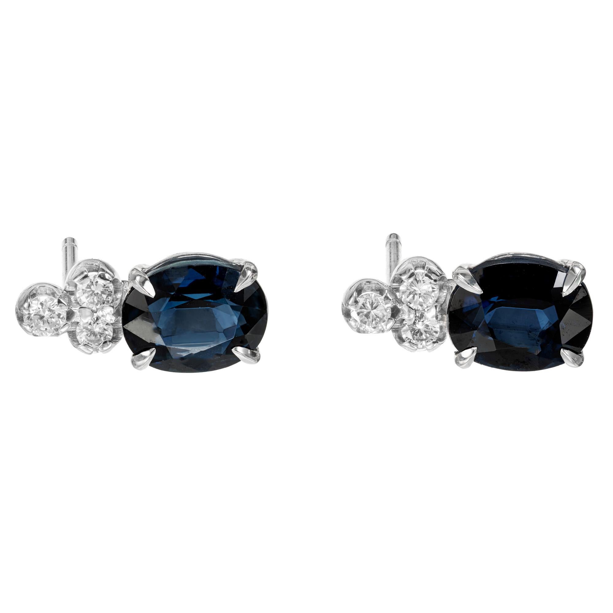 Royal blue oval Sapphire and diamond earrings. 2 oval deep blue sapphires, set in 14k white gold settings, each with 3 full cut accent diamonds above. 

2 oval deep bright blue Sapphire 7.8 x 6.2mm, approx. total weight 4.10ct, natural color and