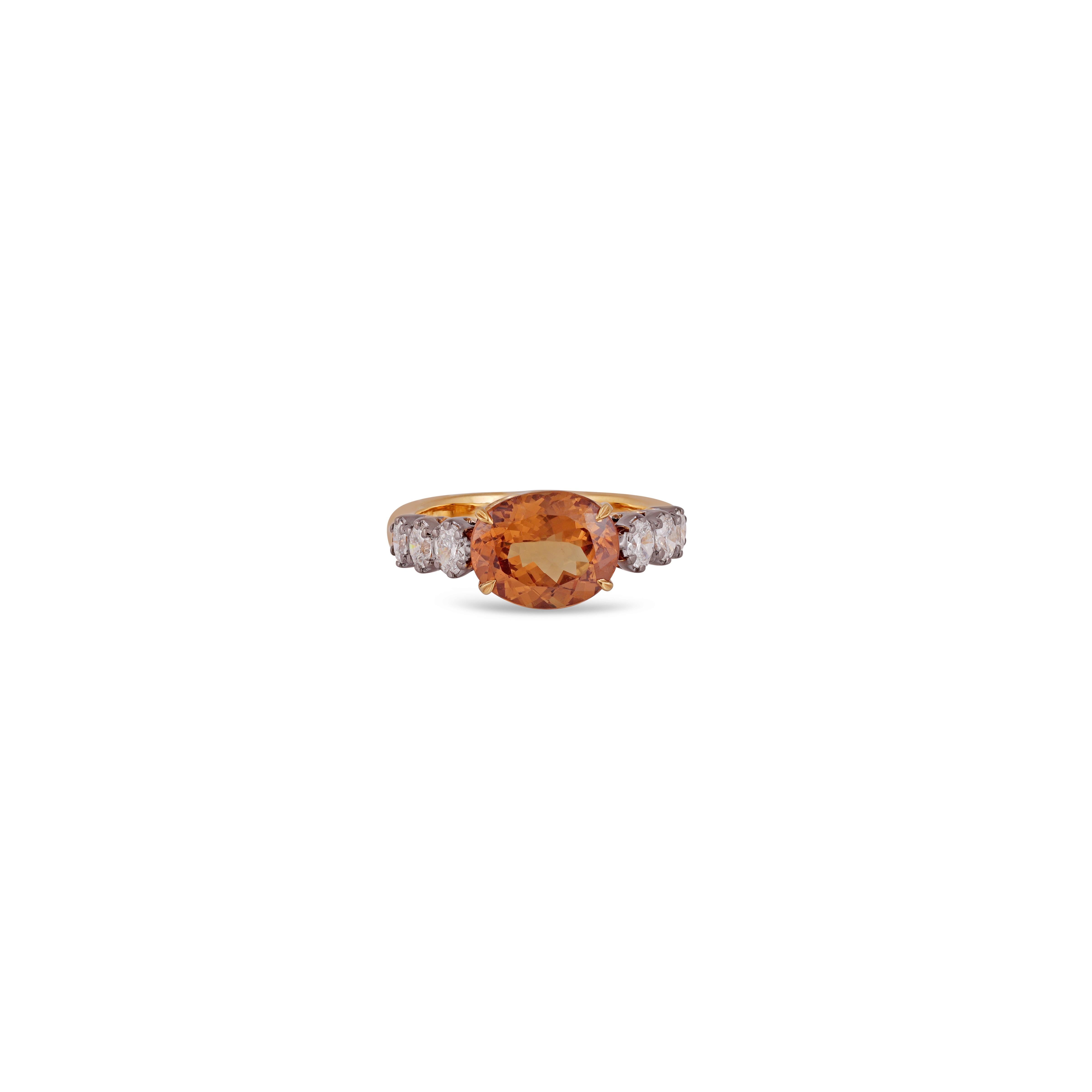 This is an elegant Garnet & diamond ring studded in 18k gold with 1 piece of  Clear Garnet  weight 4.10 carat which is surrounded by round shaped White diamonds weight 0.59 carat this entire ring studded in 18k gold 

Custom Services
Resizing is