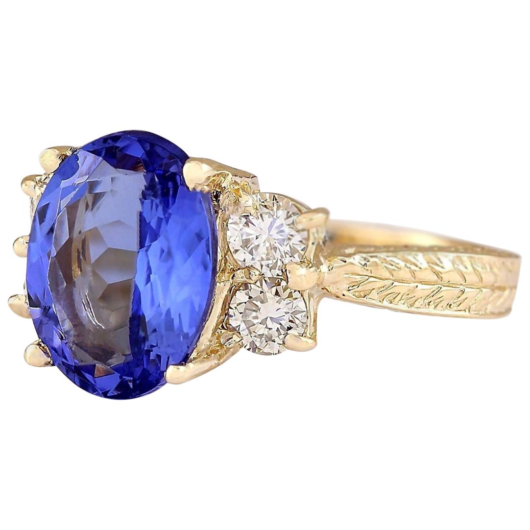 4.10 Carat Natural Tanzanite 14 Karat Yellow Gold Diamond Ring
Stamped: 14K Yellow Gold
Total Ring Weight: 5.2 Grams
Total Natural Tanzanite Weight is 3.50 Carat (Measures: 11.00x9.00 mm)
Color: Blue
Total Natural Diamond Weight is 0.60 Carat
Color: