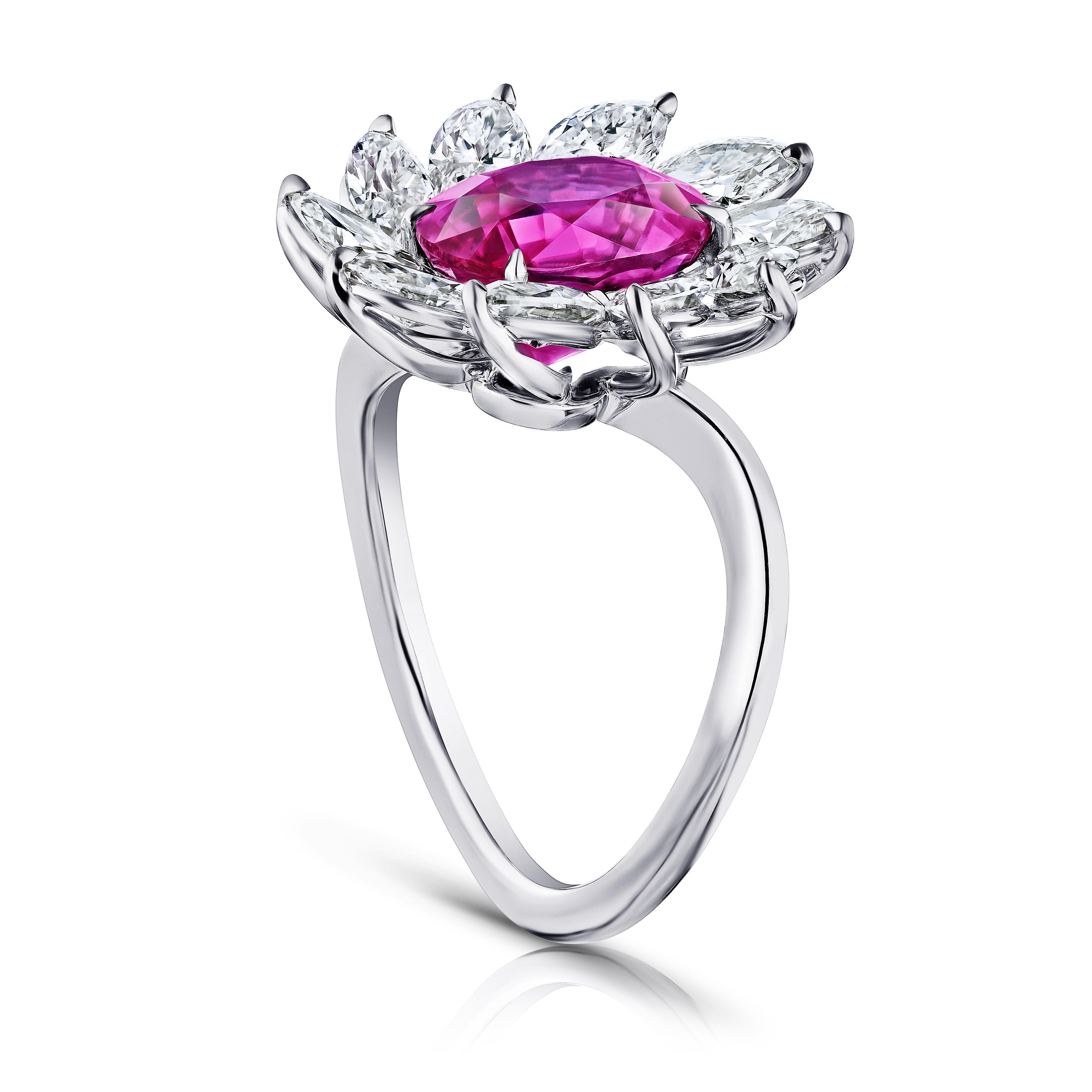 4.10 carat oval red ruby with ten marquise diamonds 2.18 carats set in a platinum hand made ring.