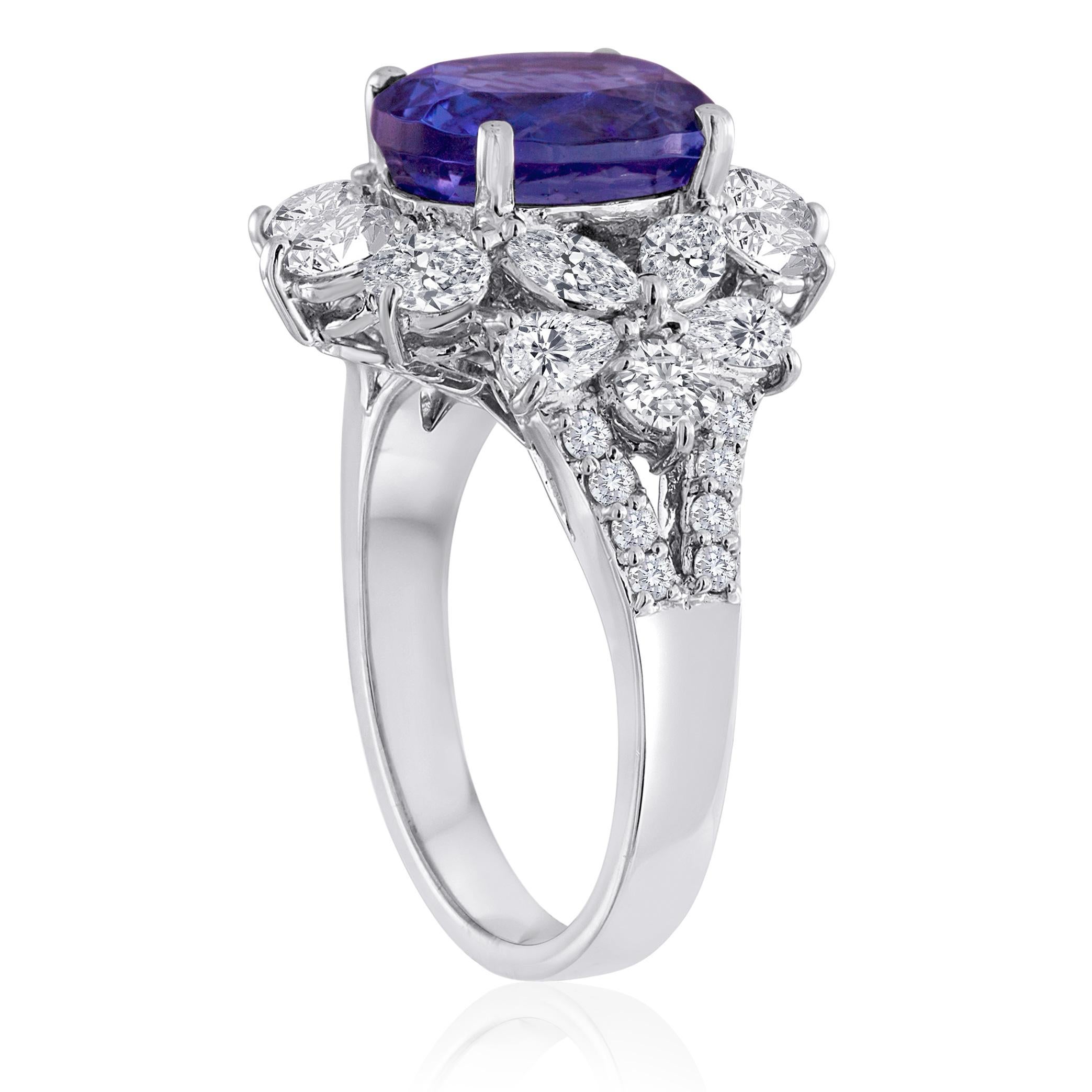 Classic Cocktail Ring
The ring is 18K White Gold
There are 2.25 Carats in Diamonds F/G VS/SI
The Center Stone is 4.10 Carats Tanzanite
The ring is a size 6.5, sizable
The ring weighs 7.9 grams