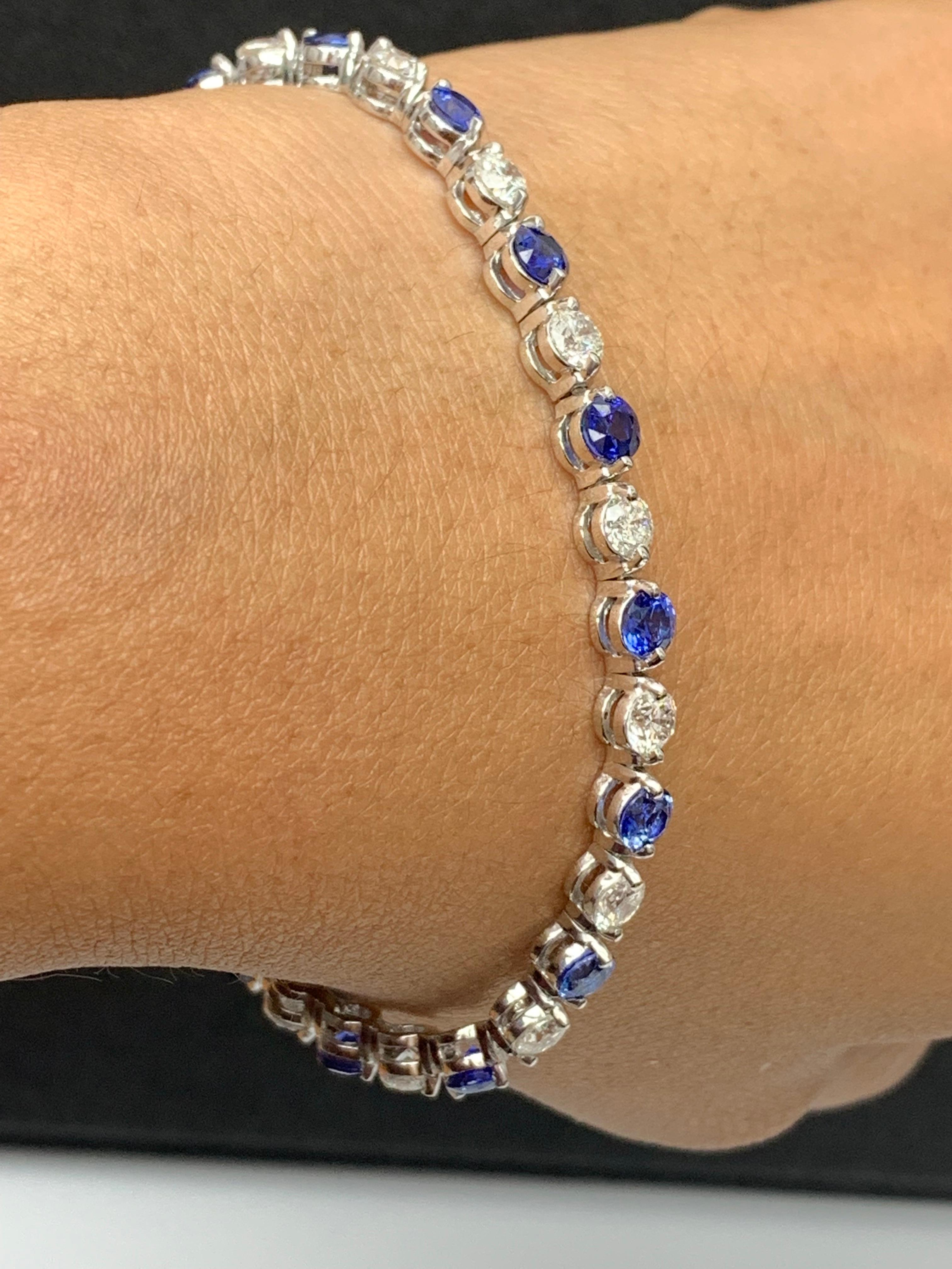 A stunning bracelet set with 16 vibrant Blue Sapphires weighing 4.10 carat total. Alternating these blue sapphires are 16 sparkling round diamonds weighing 3.92 carats in total. Set in polished 14k white gold. Double lock mechanism for maximum