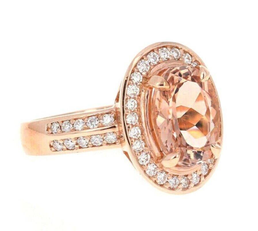 4.10 Carats Impressive Natural Morganite and Diamond 14K Solid Rose Gold Ring

Total Morganite Weight is: Approx. 3.50 Carats

Morganite Treatment: Heating

Morganite Measures: Approx. 11.00 x 9.00mm

Natural Round Diamonds Weight: Approx. 0.60