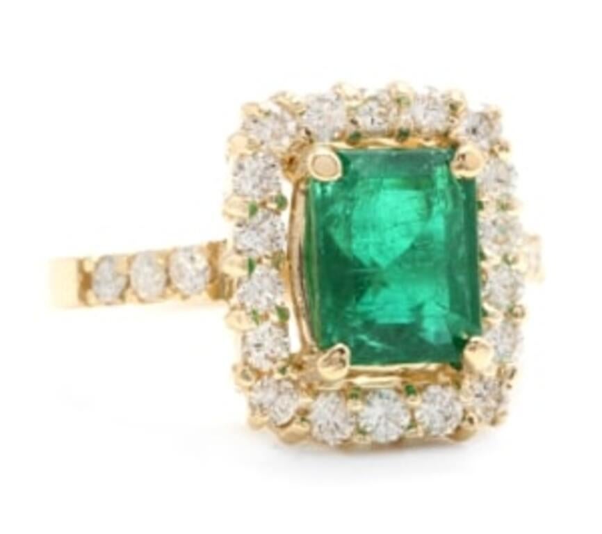 4.10 Carats Natural Emerald and Diamond 18K Solid Yellow Gold Ring

Total Natural Green Emerald Weight is: Approx. 3.20 Carats (transparent)

Emerald Measures: Approx. 9 x 7mm

Emerald Treatment: Oiling

Natural Round Diamonds Weight: Approx. 0.90