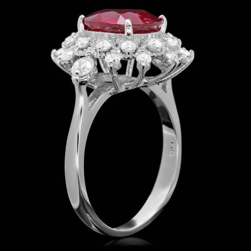4.10 Carats Impressive Natural Red Ruby and Diamond 14K White Gold Ring

Total Red Ruby Weight is: Approx. 3.40 Carats 

Ruby Measures: Approx. 10.00 x 8.00mm

Ruby treatment: Fracture Filling

Natural Round Diamonds Weight: Approx. 0.70 Carats