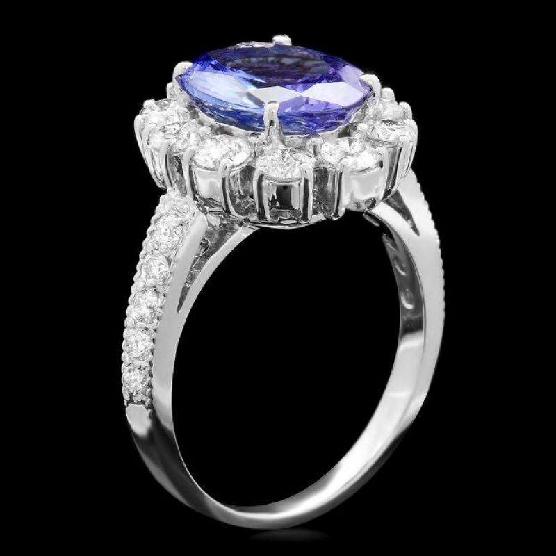 4.10 Carats Natural Tanzanite and Diamond 14K Solid White Gold Ring

Total Natural Triangular Tanzanite Weight is: Approx. 2.90 Carats 

Tanzanite Measures: Approx. 10.00 x 8.00mm

Natural Round Diamonds Weight: Approx. 1.20 Carats (color G-H /