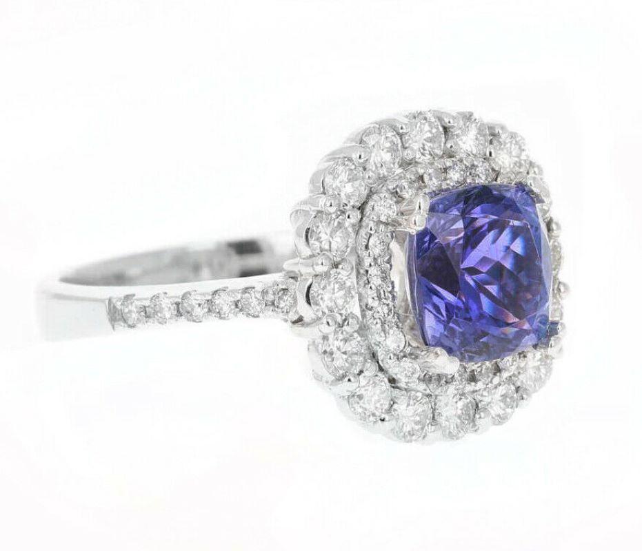 4.10 Carats Natural Very Nice Looking Tanzanite and Diamond 14K Solid White Gold Ring

Total Natural Cushion Cut Tanzanite Weight is: Approx. 3.00 Carats

Tanzanite Measures: Approx. 8.00 x 8.00mm

Natural Round Diamonds Weight: Approx. 1.10 Carats
