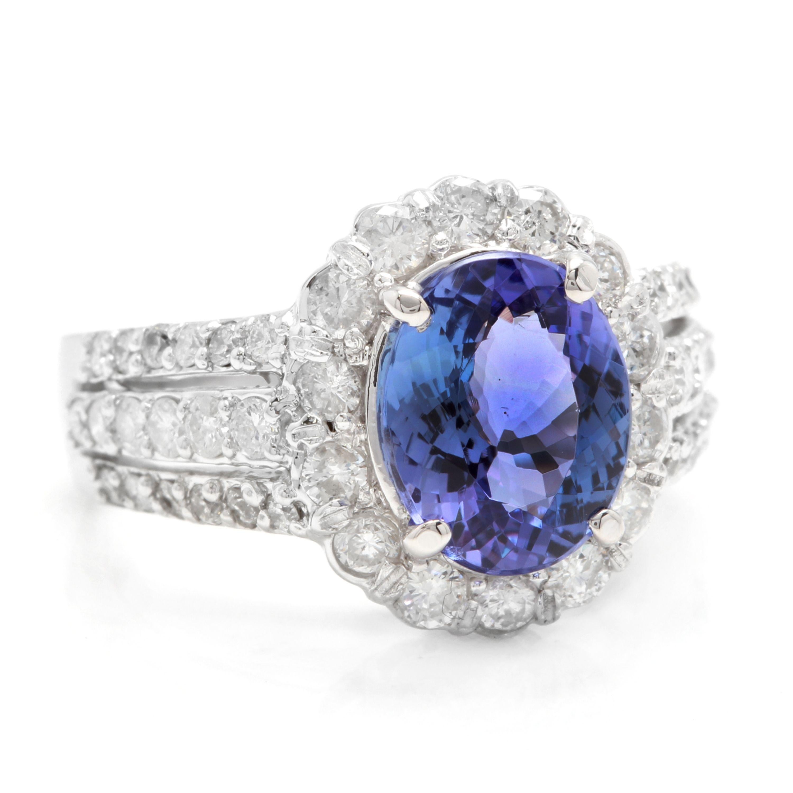 4.10 Carats Natural Very Nice Looking Tanzanite and Diamond 14K Solid White Gold Ring

Total Natural Oval Cut Tanzanite Weight is: Approx. 2.90 Carats

Tanzanite Measures: Approx. 9.00 x 7.00mm

Natural Round Diamonds Weight: Approx. 1.20 Carats
