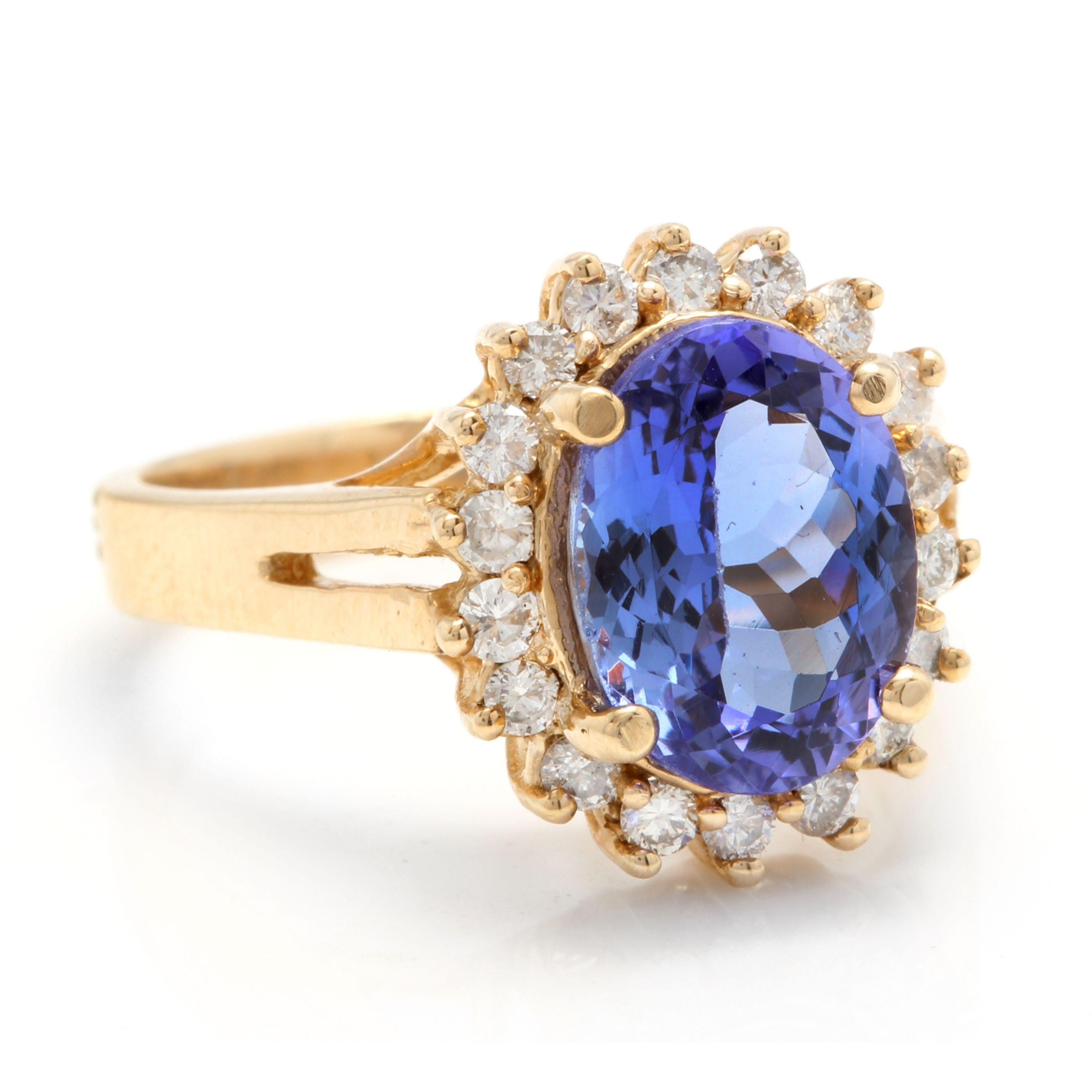 4.10 Carats Natural Very Nice Looking Tanzanite and Diamond 14K Solid Yellow Gold Ring

Total Natural Oval Shaped Tanzanite Weight is: Approx. 3.50 Carats

Aquamarine Measures: Approx. 11.00 x 8.40mm

Natural Round Diamonds Weight: Approx. 0.60