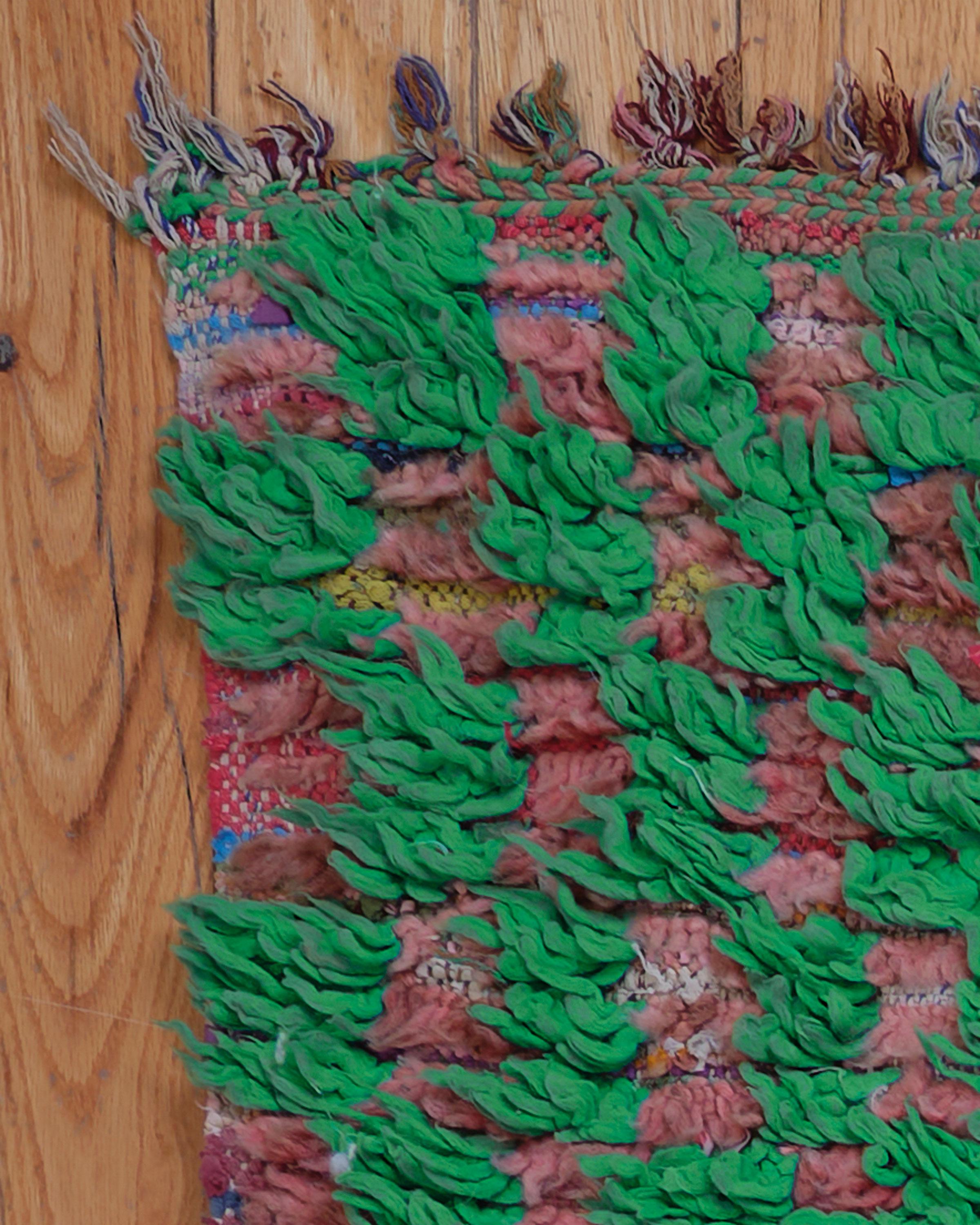 The Bou 03 rug is a stunning Boucherouite piece, handwoven by skilled Berber women in Morocco using a blend of cotton and 100% natural sheep’s wool. Featuring a vibrant array of colors, this multicolor rug showcases unique patterns and irregular