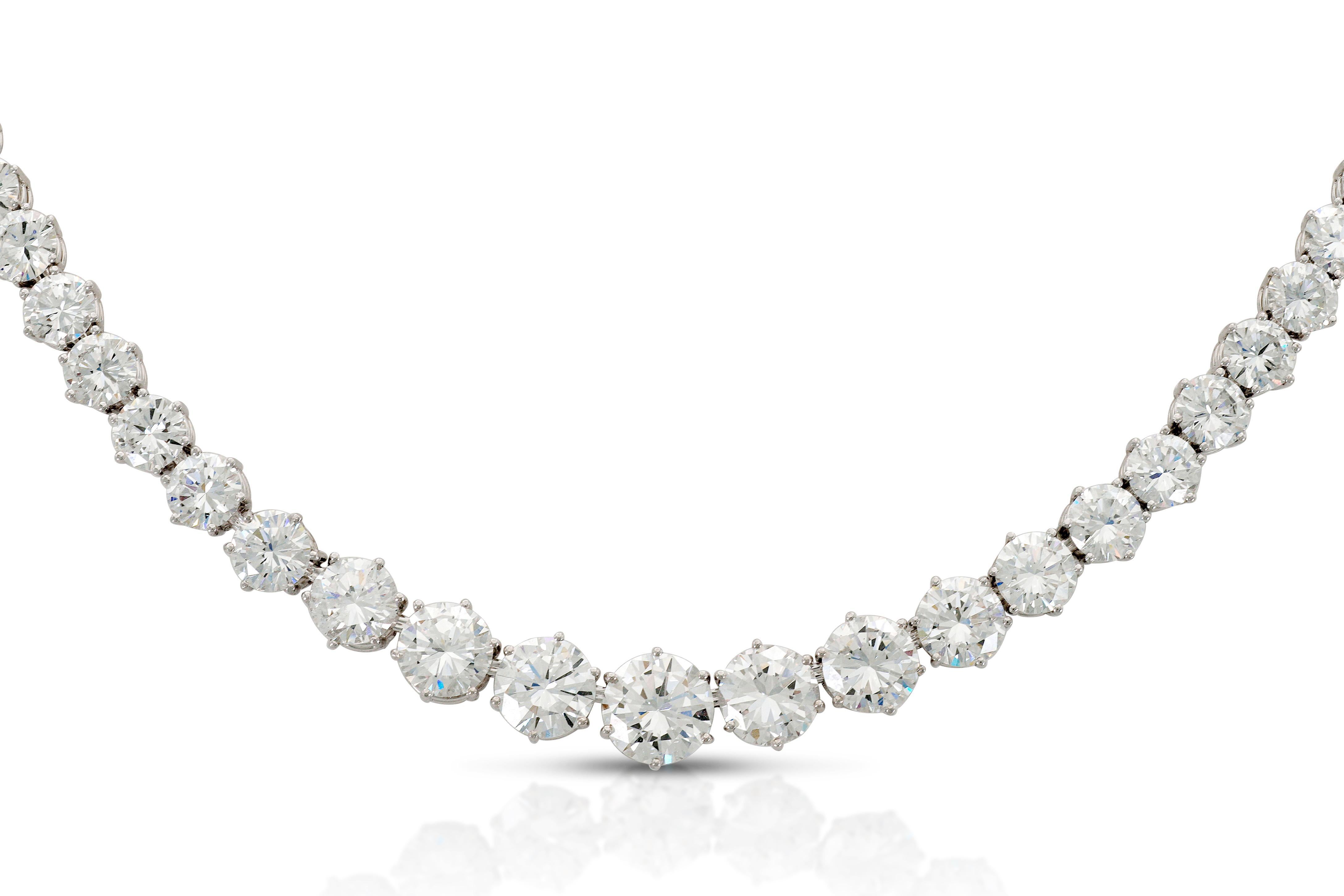 Finely crafted in platinum with graduating Round Brilliant cut Diamonds weighing a total of approximately 41.00 carats.
The 7 larger center Diamonds are GIA certified:
2.06 ct, F/SI1, GIA #2141928028
1.57 ct, D/VS1, GIA #1146923910
1.50 ct, E/VVS2,