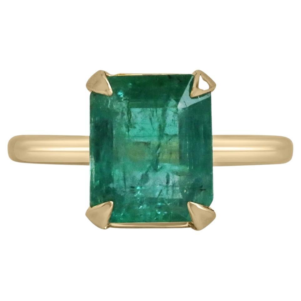 4.10ct 18K Four Prong Medium Mossy Green Emerald Cut Emerald Solitaire Ring