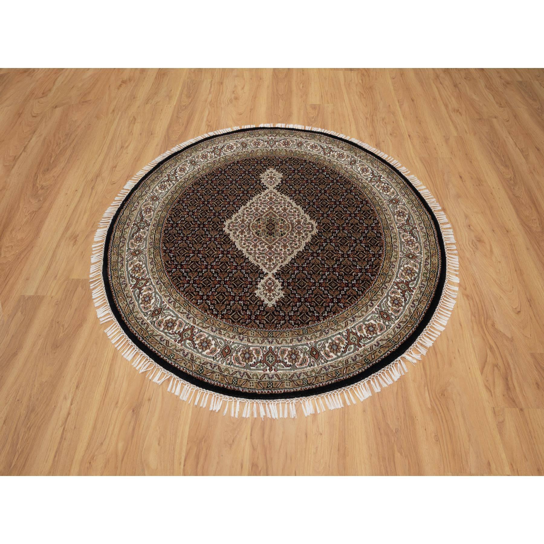 Onyx Black, Tabriz Mahi with Fish Medallion Design, 175 KPSI, Pure Wool, Hand Knotted, Round, Oriental Rug
Primary materials: Wool
Latex: No Pile 
height: 0.25 Inches
Style: Traditional
Primary color: Black
Secondary colors: Green, Brown, Red,