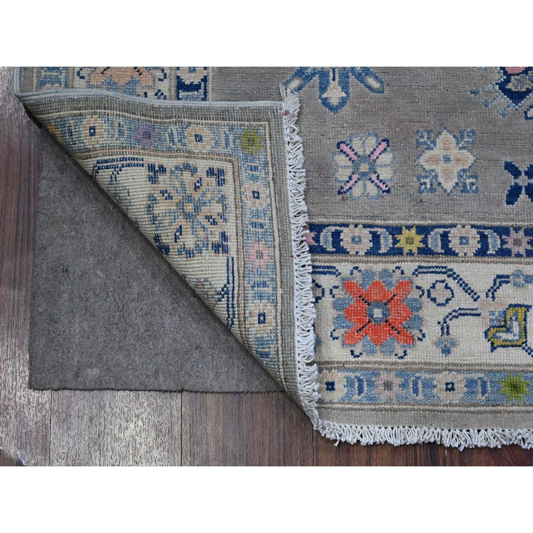This is a truly genuine one-of-a-kind Fusion Kazak, Hand Knotted, Pure Wool, Oriental Rug. It has been Knotted for months and months in the centuries-old weaving craftsmanship techniques by expert artisans.
Primary materials: Wool
Latex: No Pile