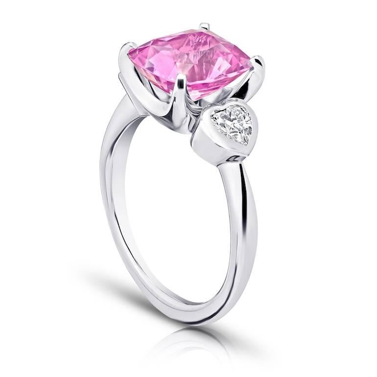 4.11 carat cushion pink spinel with heart shape diamonds .47 carats set in platinum  ring.
