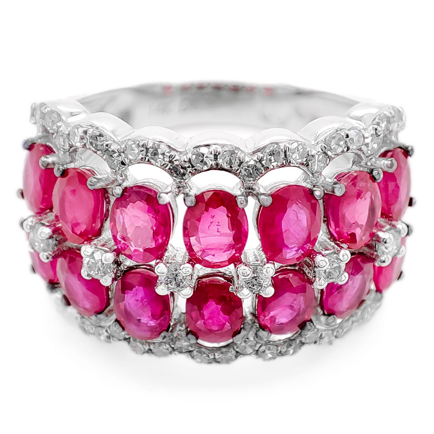 FOR US CUSTOMER NO VAT!

You've described a magnificent 4.11 carat total weight (CTW) red ruby and diamond ring, crafted in 14K white gold. The centerpiece of this exquisite ring is a cluster of 14 oval-cut red ruby stones, with a total ruby weight