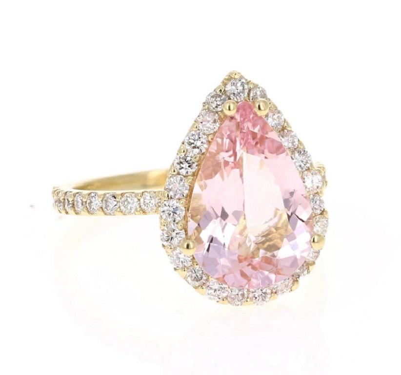 A lovely Engagement Ring Option or as an alternate to a Pink Diamond Ring! A Stunning Statement. 

This gorgeous and classy Morganite Diamond Ring has a 3.25 Carat Pear Cut Pink Morganite and has a Halo of 45 Round Cut Diamonds that weigh 0.87