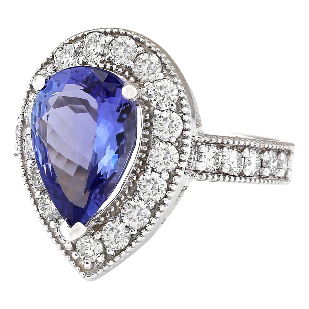 Stamped: 14K White Gold
Total Ring Weight: 7.1 Grams
Total Natural Tanzanite Weight is 3.02 Carat (Measures: 13.00x9.00 mm)
Color: Blue
Total Natural Diamond Weight is 1.10 Carat
Color: F-G, Clarity: VS2-SI1
Face Measures: 19.25x14.30 mm
Sku: