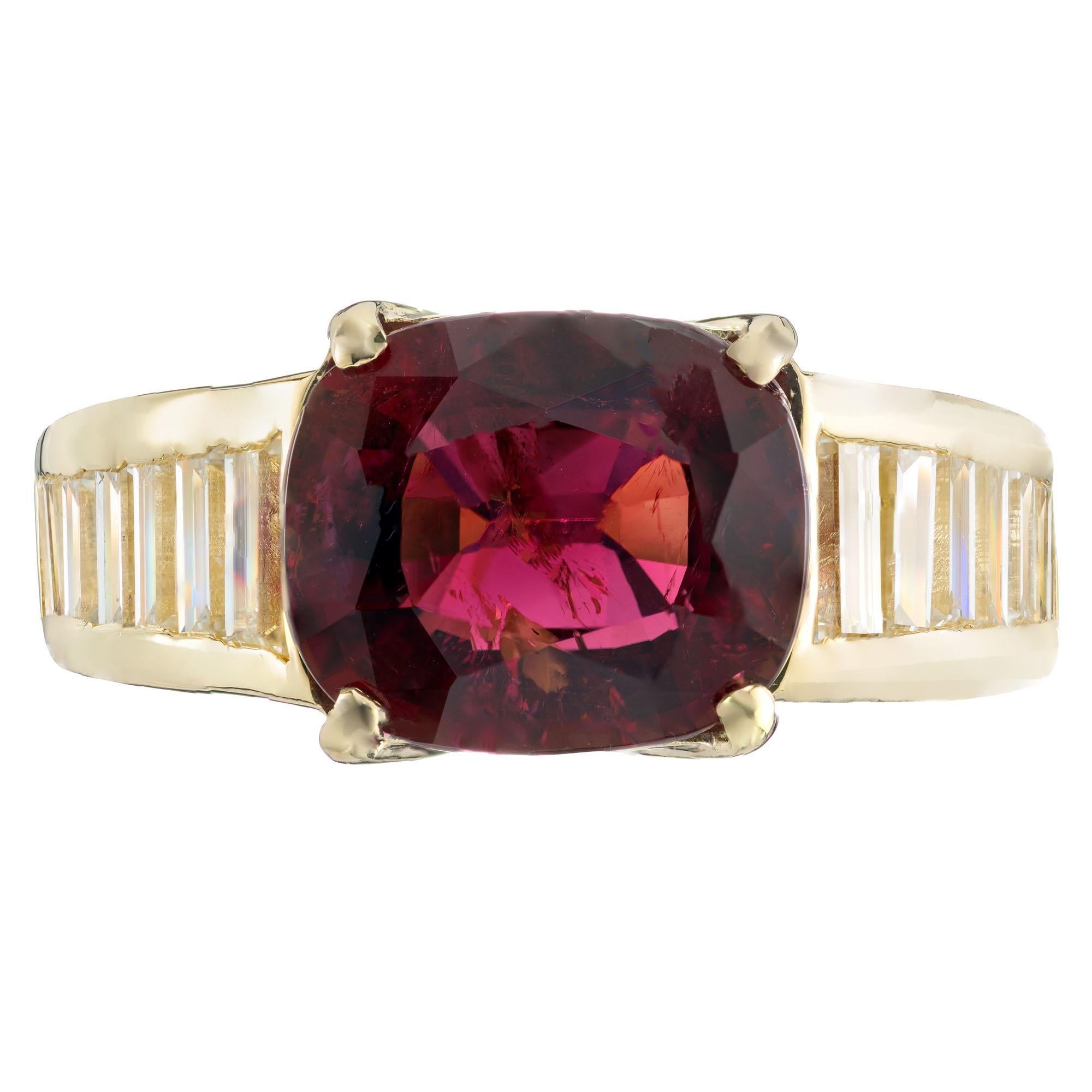 4.12 carat cushion shape red tourmaline rubellite. 18k yellow gold setting with straight cut baguette side diamonds. 

1 cushion shape rubellite reddish pink tourmaline SI2, approx. 4.12ct
14 straight cut baguette diamonds I-J VS, approx.