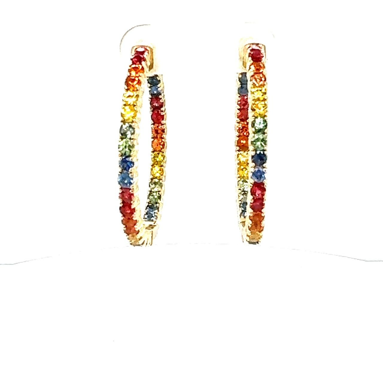 4.12 Carat Rainbow Sapphire Yellow Gold Hoop Earrings
Beautiful Statement Earrings 

Item Specifics:

60 Round Cut Multi-Colored Natural Sapphires weighing 4.12 carats
Total Carat Weight is 4.12 carats
Crafted in 14K Yellow Gold approximately 6.9
