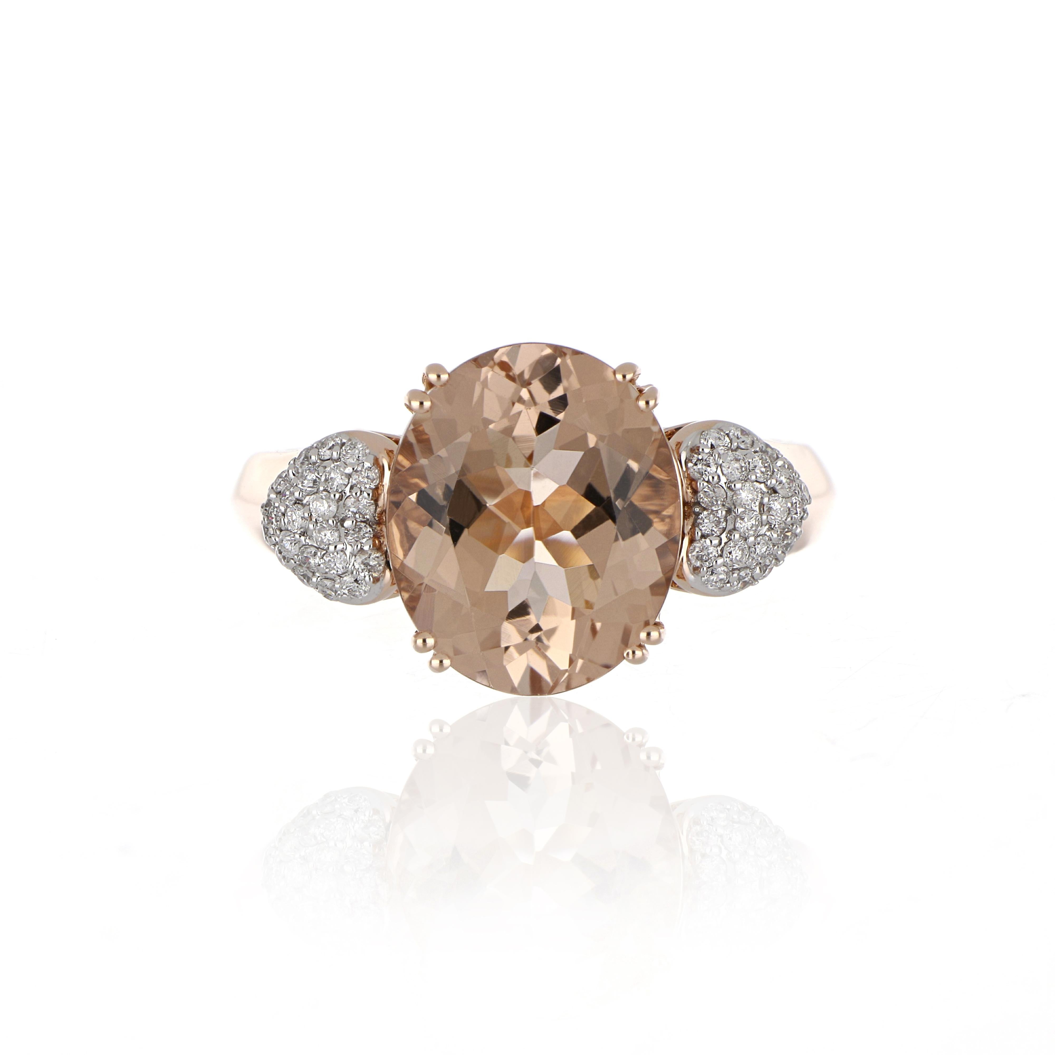 Elegant and exquisitely detailed Cocktail 14K Ring, centre set with 4.12 Ct Oval Morganite, accented with Diamonds on shoulders, weighing approx. 0.21 cts. total carat weight. Beautifully Hand crafted in 14 Karat Rose Gold.

Stone Size:
Morganite: