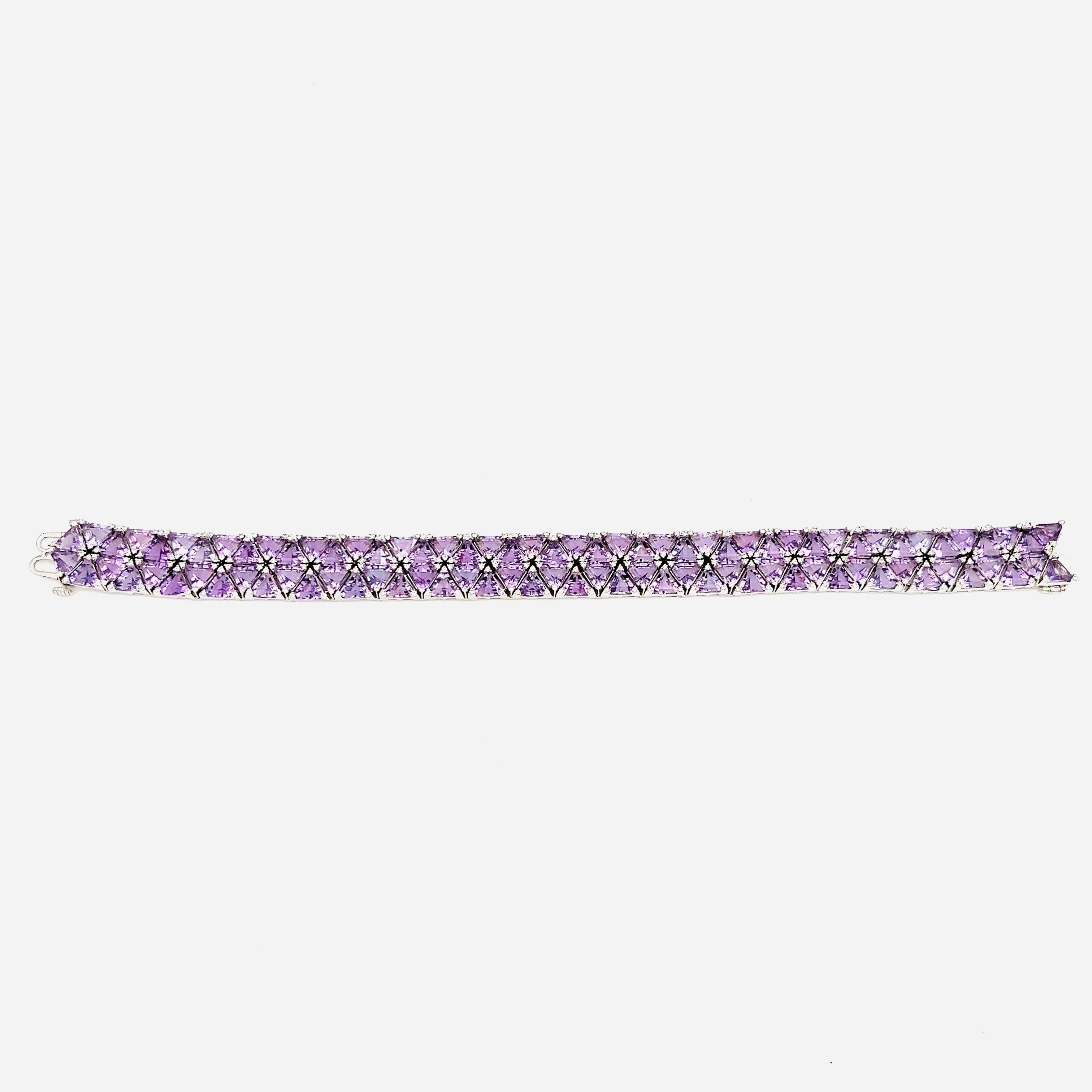 This amazing natural amethyst and diamond bracelet boasts a total of 41.29 ct. The bracelet features 92 trillion shaped natural amethysts weighing 39.90 ct. The 276 diamonds on the bracelet make up 1.39 ct and are F/G in color and VS2/SI1 in