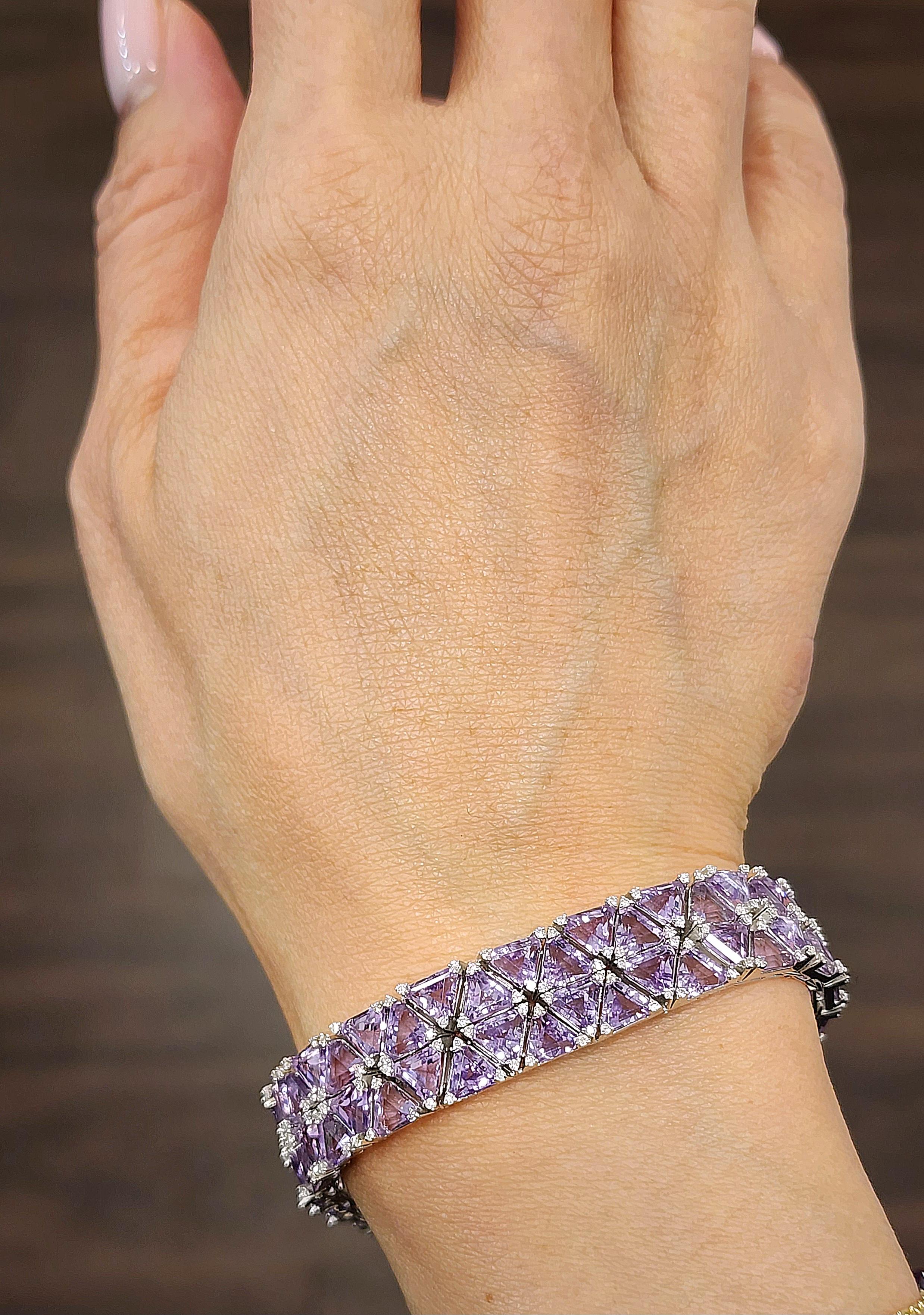 This amazing natural amethyst and diamond bracelet boasts a total of 41.29 ct. The bracelet features 92 trillion shaped natural amethysts weighing 39.90 ct. The 276 diamonds on the bracelet make up 1.39 ct and are F/G in color and VS2/SI1 in