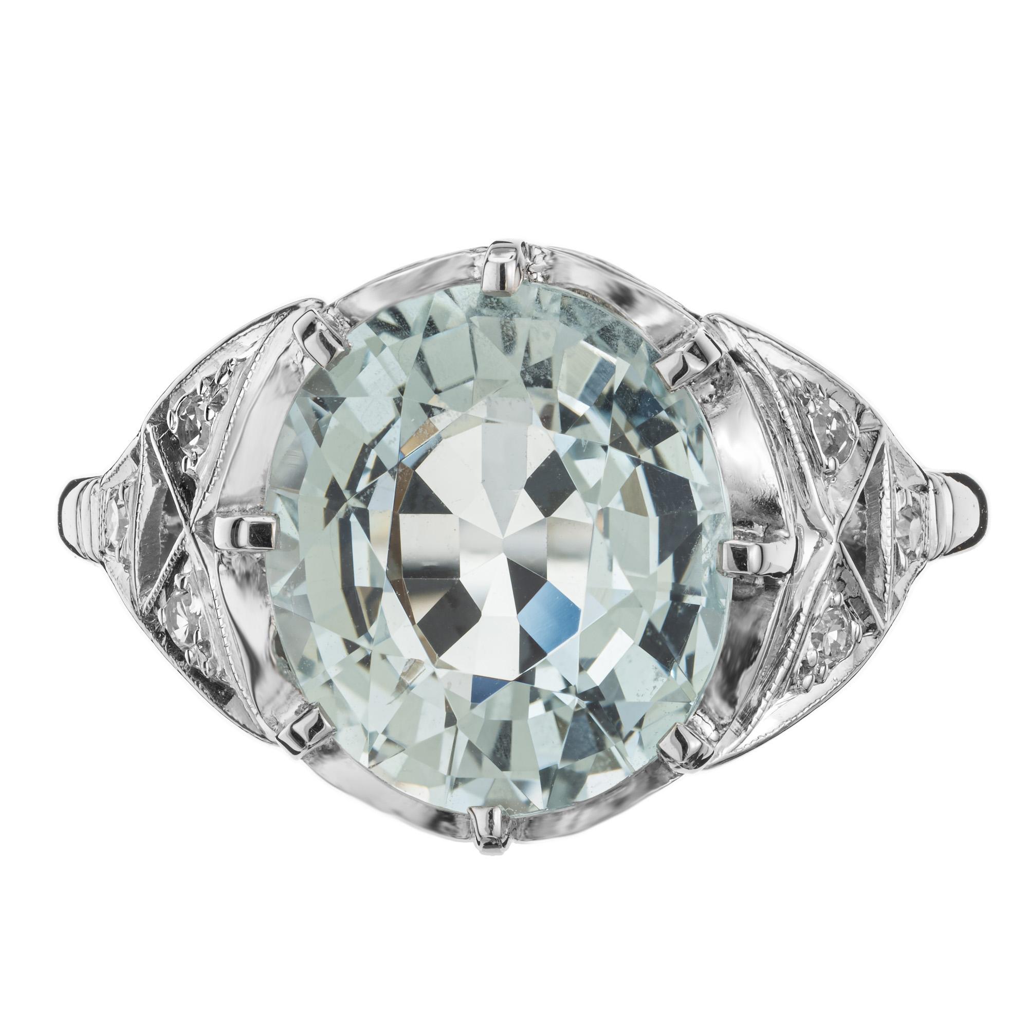 1915 original 4.13 Carat Aquamarine and Diamond Platinum Art Deco open work ring. The centerpiece, a stunning 4.13 carat aquamarine gemstone, showcases a captivating icy blue and greenish hue. Mounted in a platinum setting and accented with 6 single