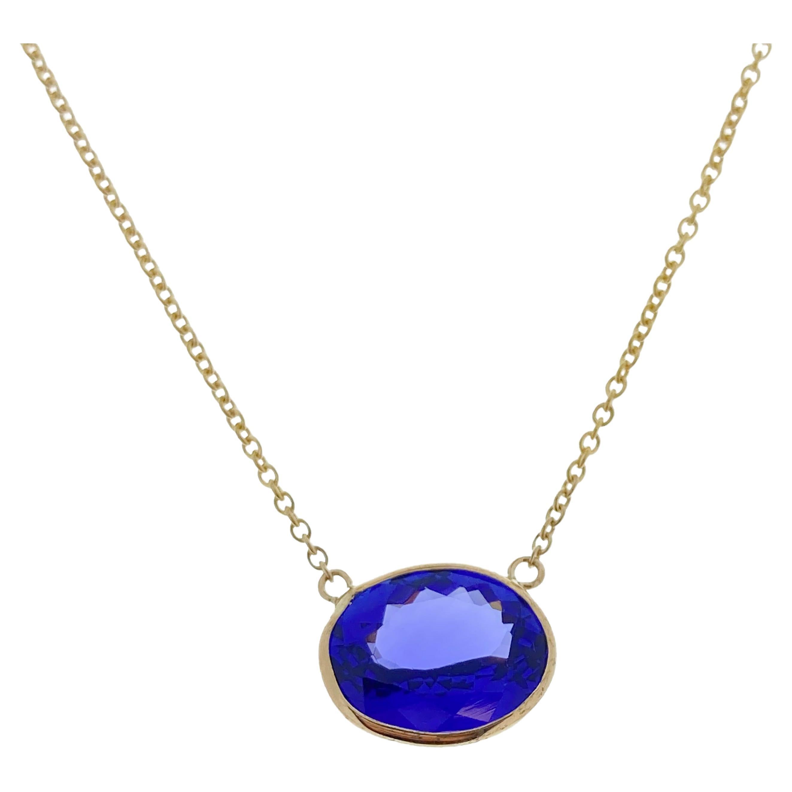 4.13 Carat Oval Blue Tanzanite Fashion Necklaces In 14k Yellow Gold  For Sale
