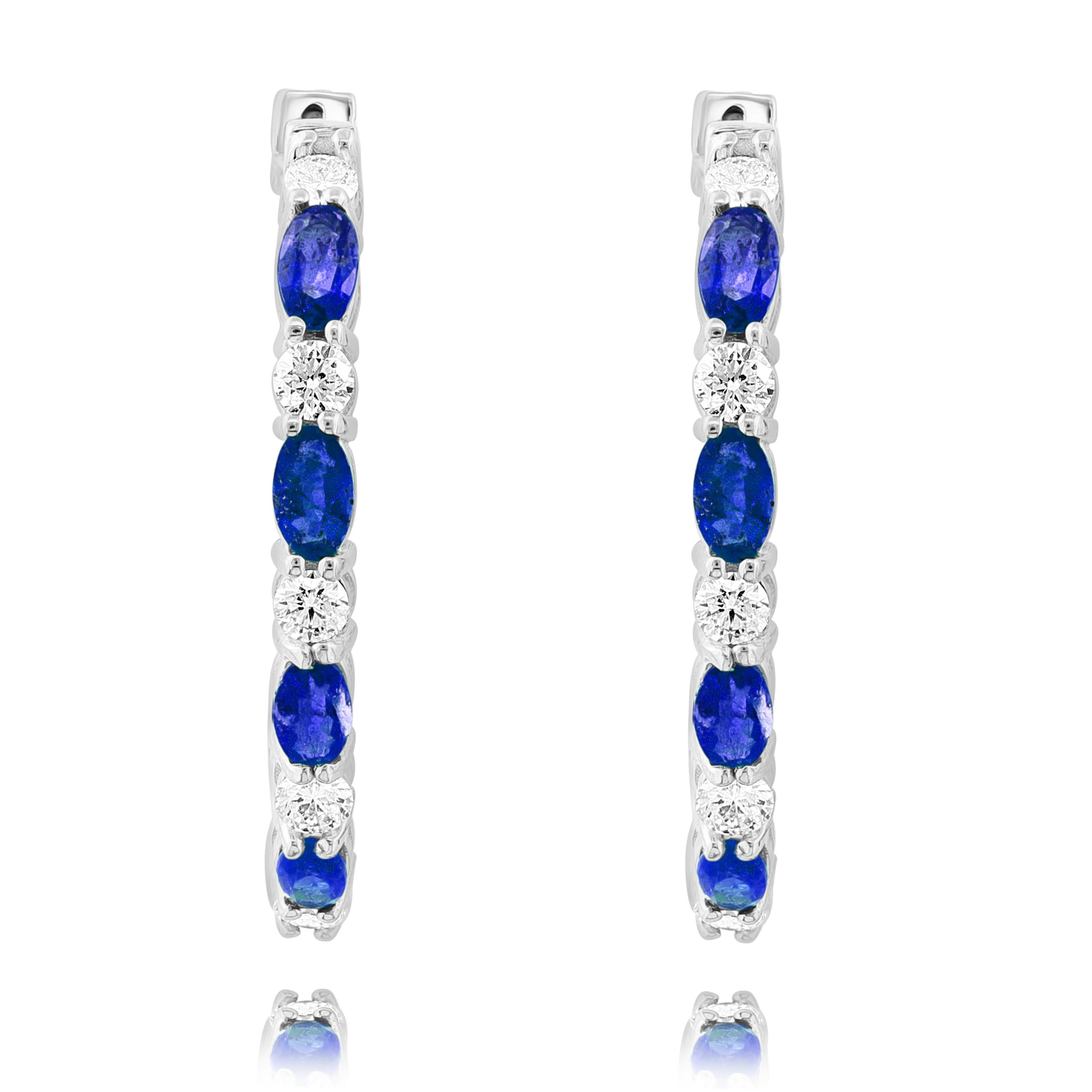 A stylish and versatile style hoop earring showcasing oval cut 14 blue sapphires weighing 4.13 carats total, channel set in a diamond-encrusted 14-karat White gold mounting. 18 Diamonds weigh 1.79 carats in total.

All diamonds are GH color SI1