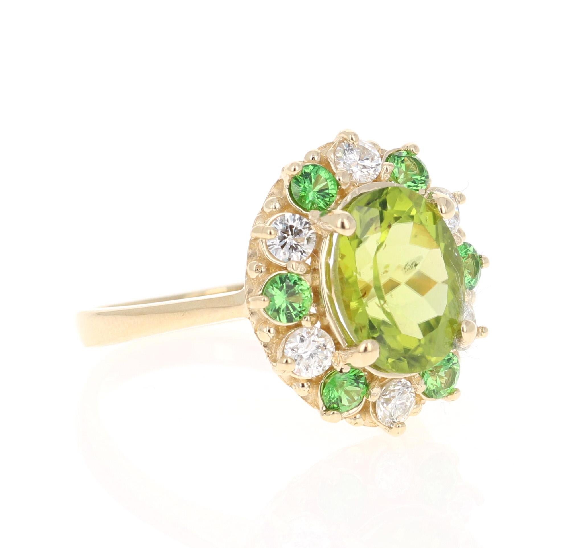 4.13 Carat Peridot Diamond Tsavorite Yellow Gold Ring - this can be a stunning and unique alternative to a unique engagement ring!

This beautiful ring has a Oval Cut Peridot in the center that weighs 3.14 carats. The Peridot measures at 8 mm x 10