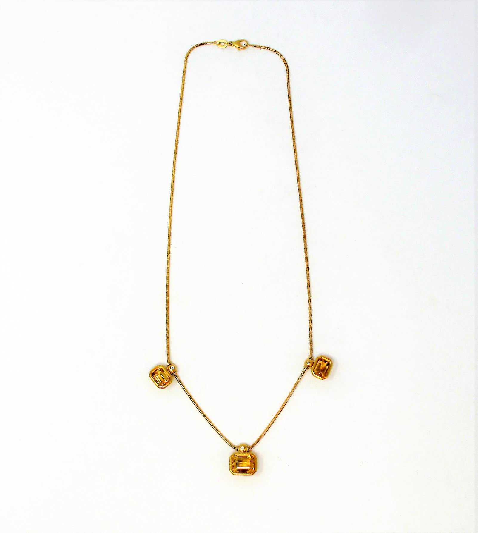 This lovely station necklace adds a rich, golden touch to your look! Beautiful emerald cut citrine stones with just a hint of diamond sparkle make this modern beauty a perfect addition to your jewelry closet.  

This gorgeous station necklace