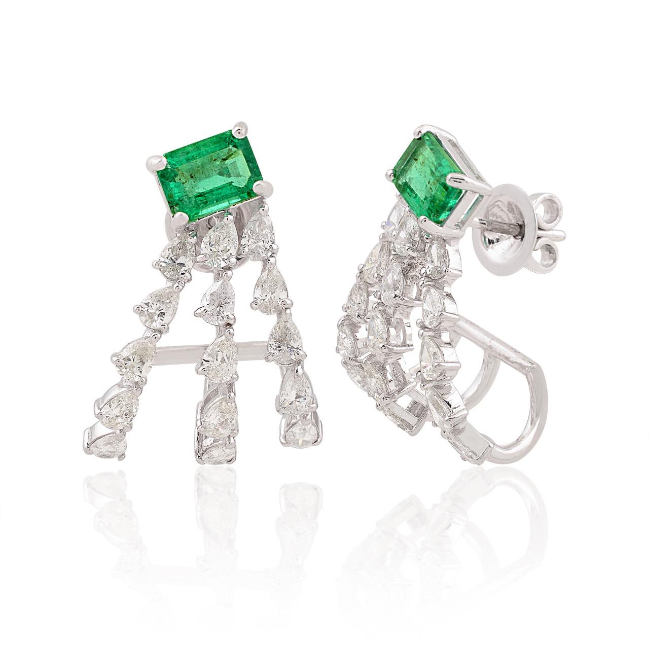 Cast in 14-karat gold, these beautiful hoop earrings are hand set with 4.13 carats of emerald and 2.21 carats of sparkling diamonds. 

FOLLOW  MEGHNA JEWELS storefront to view the latest collection & exclusive pieces.  Meghna Jewels is proudly rated