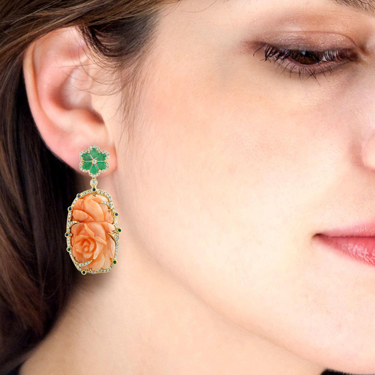 These earrings are crafted in 18-karat gold. It is hand set in 41.31 carats coral, 1.8 carats emerald, .16 carats sapphire and 1.19 carats of glimmering diamonds.

FOLLOW  MEGHNA JEWELS storefront to view the latest collection & exclusive pieces. 