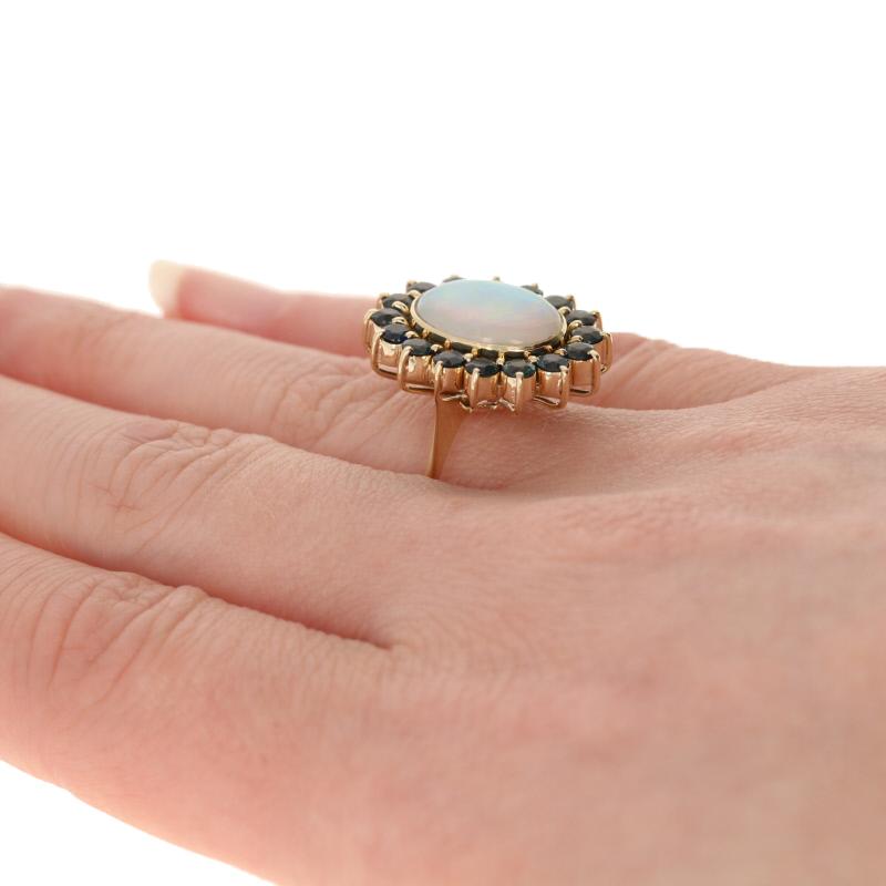 4.13 Carat Oval Cabochon Cut Opal and Sapphire Ring, 18 Karat Yellow Gold Halo 1