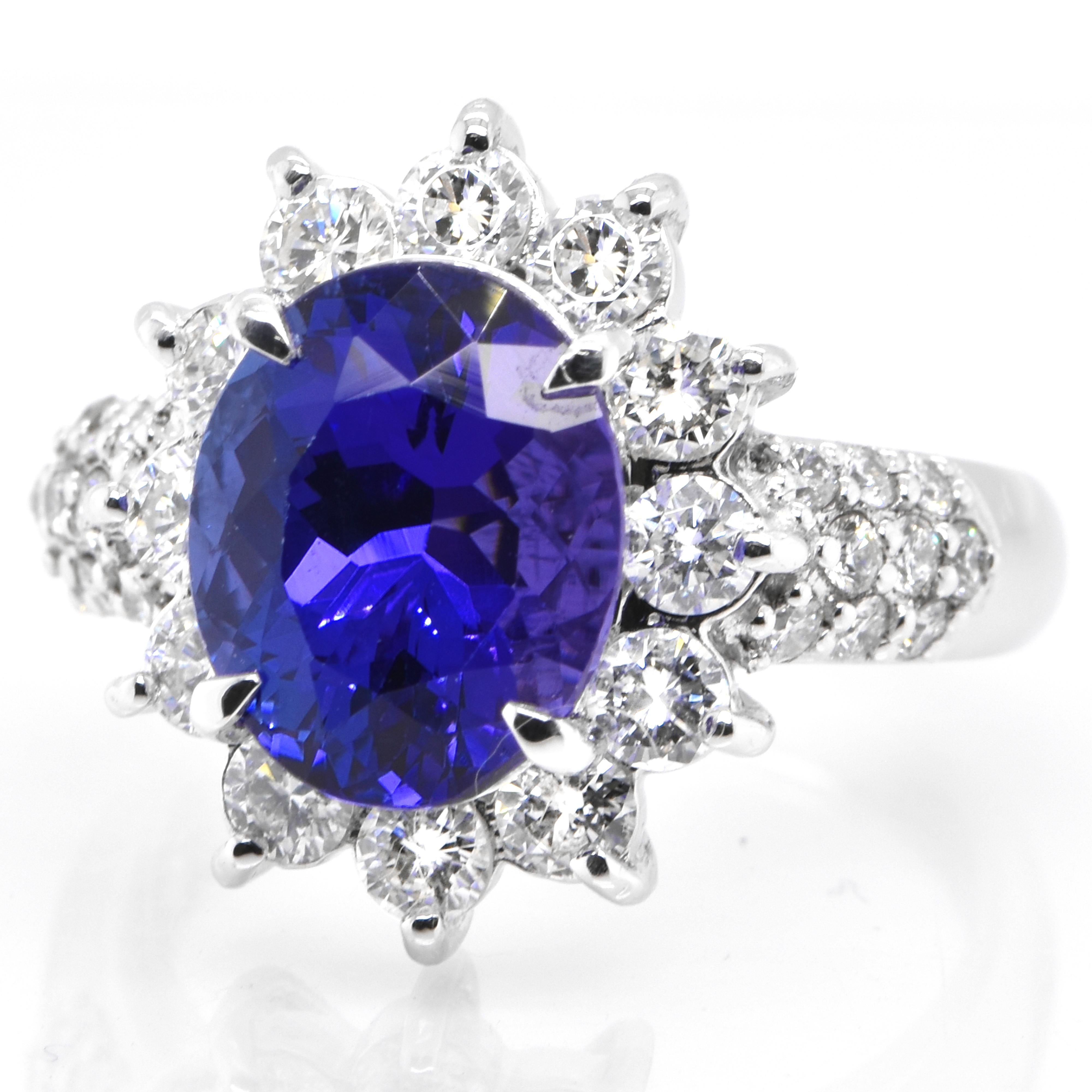 A beautiful ring featuring a 4.14 Carat Natural Tanzanite and 1.43 Carats Diamond Accents set in Platinum. Tanzanite's name was given by Tiffany and Co after its only known source: Tanzania. Tanzanite displays beautiful pleochroic colors meaning