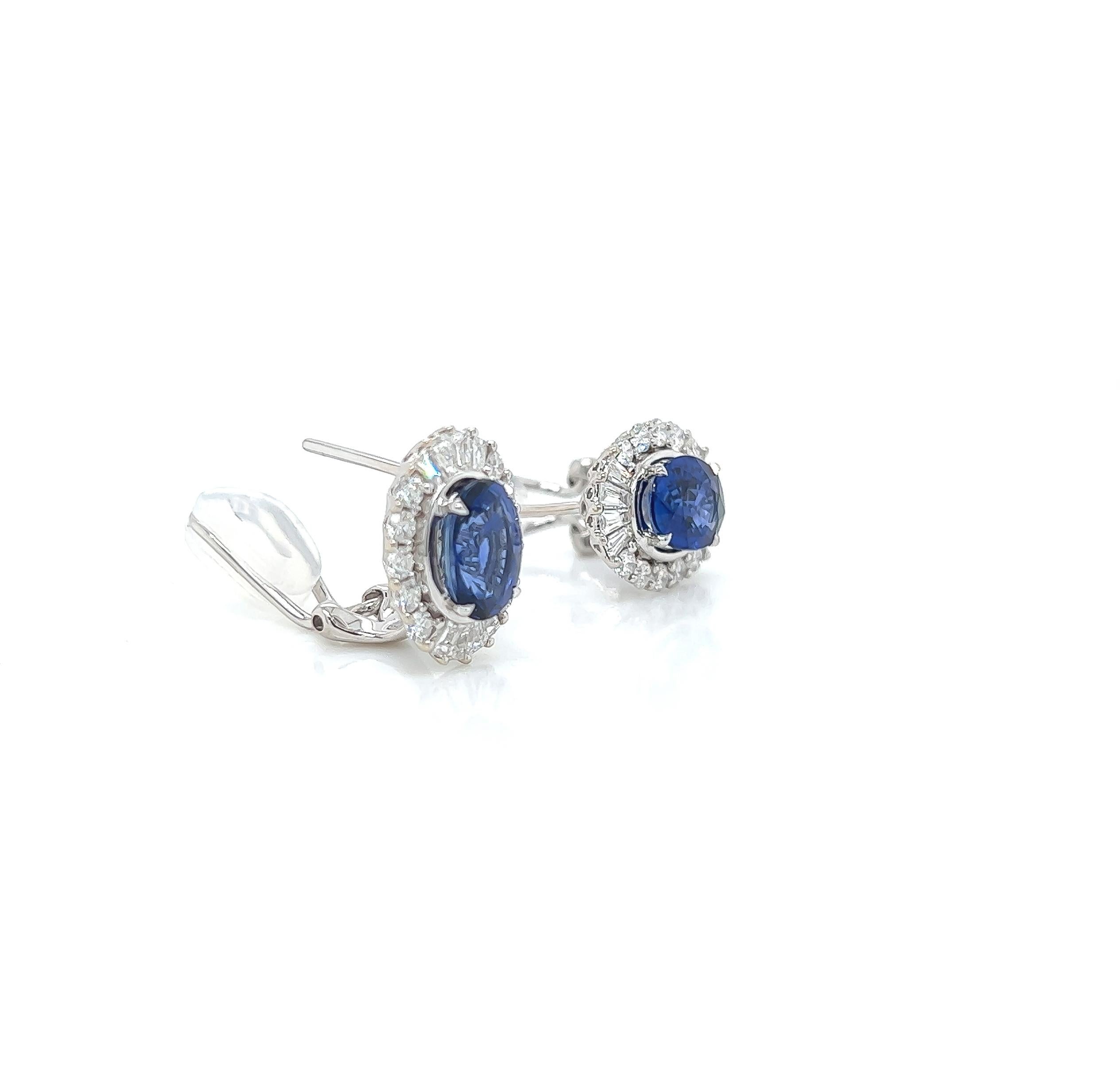 4.14 Total Carat Sapphire and Diamond Earrings in 14K White Gold

This gorgeous pair of sapphire earrings are sure to draw all eyes on you. It is created with a single 3.20 Carat Oval Sapphire, surrounded by a halo of Emerald and Round cut diamonds