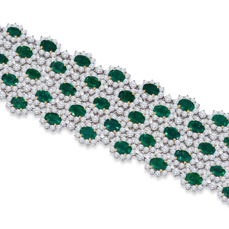 Exceptional emerald and diamond bracelet in 18KT white and yellow gold custom designed around an outstanding collection of 60 oval shaped gem quality emeralds of Columbian origin for a total weight of 41.72 carats. The emeralds feature outstanding